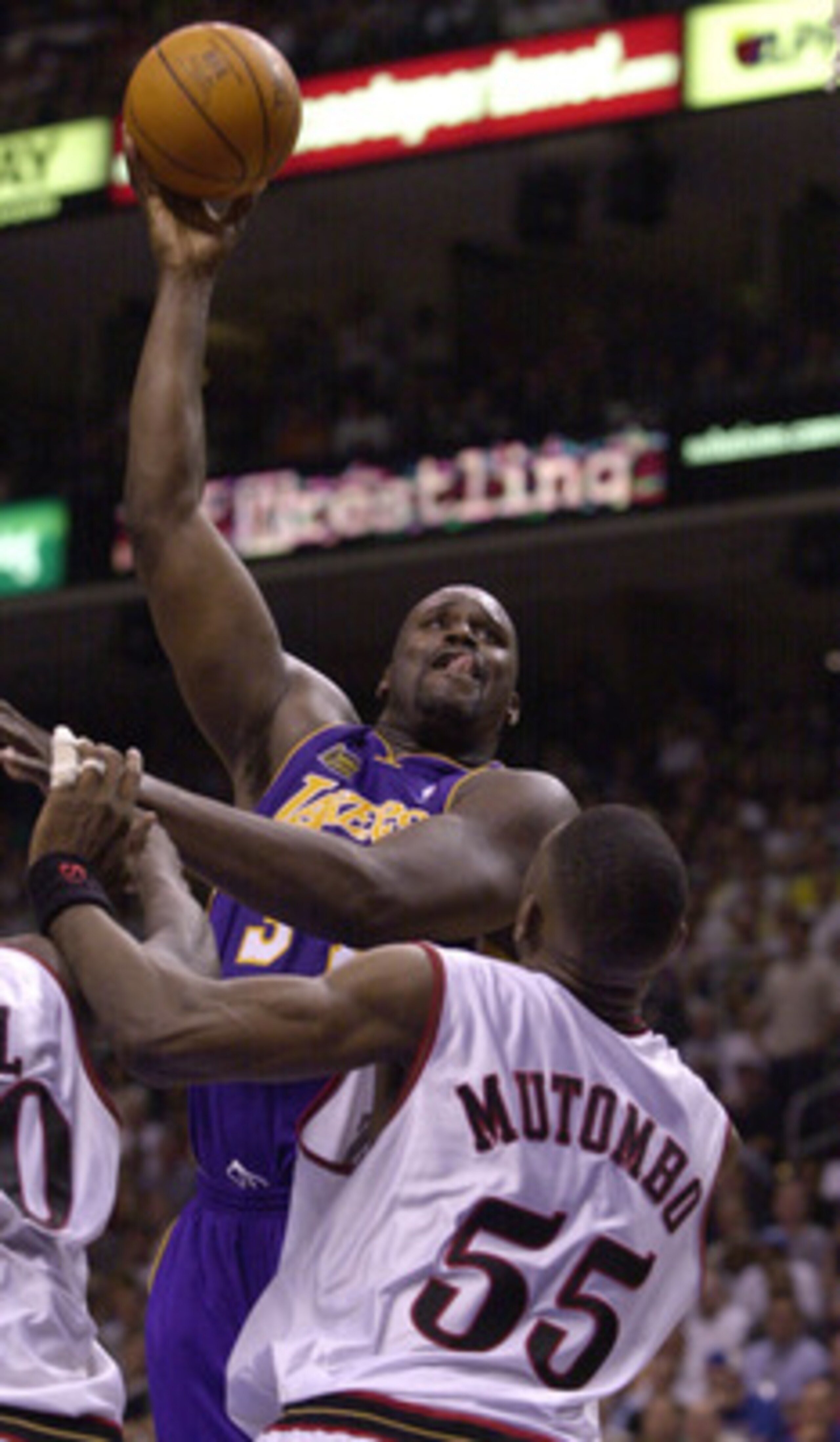 10 Jun 2001:  Shaquille O''Neal #34 of the Los Angeles Lakers shoots a hook shot over Dikembe Mutombo #55 of the Philadelphia 76ers during game 3 of the NBA Finals at the First Union Center in Philadelphia, Pennsylvania.  DIGITAL IMAGE Mandatory Credit: E