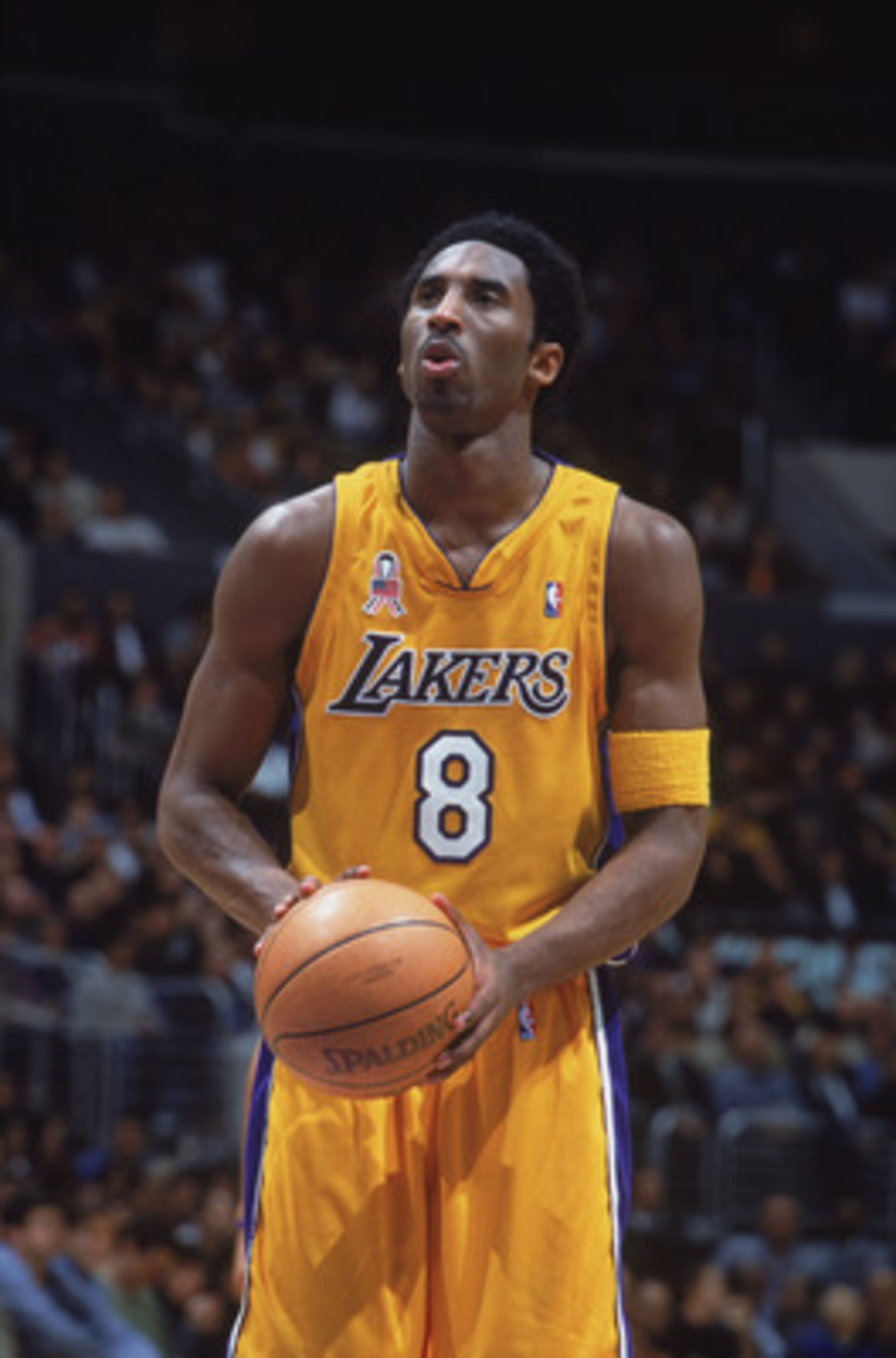 27 Nov 2001:  Kobe Bryant #8 of the Los Angeles Lakers looks to make a free throw during the National Anthem before the game against the Milwaukee Bucks at the STAPLES Center in Los Angeles, California. The Lakers defeated the Bucks 104-85. NOTE TO USER: