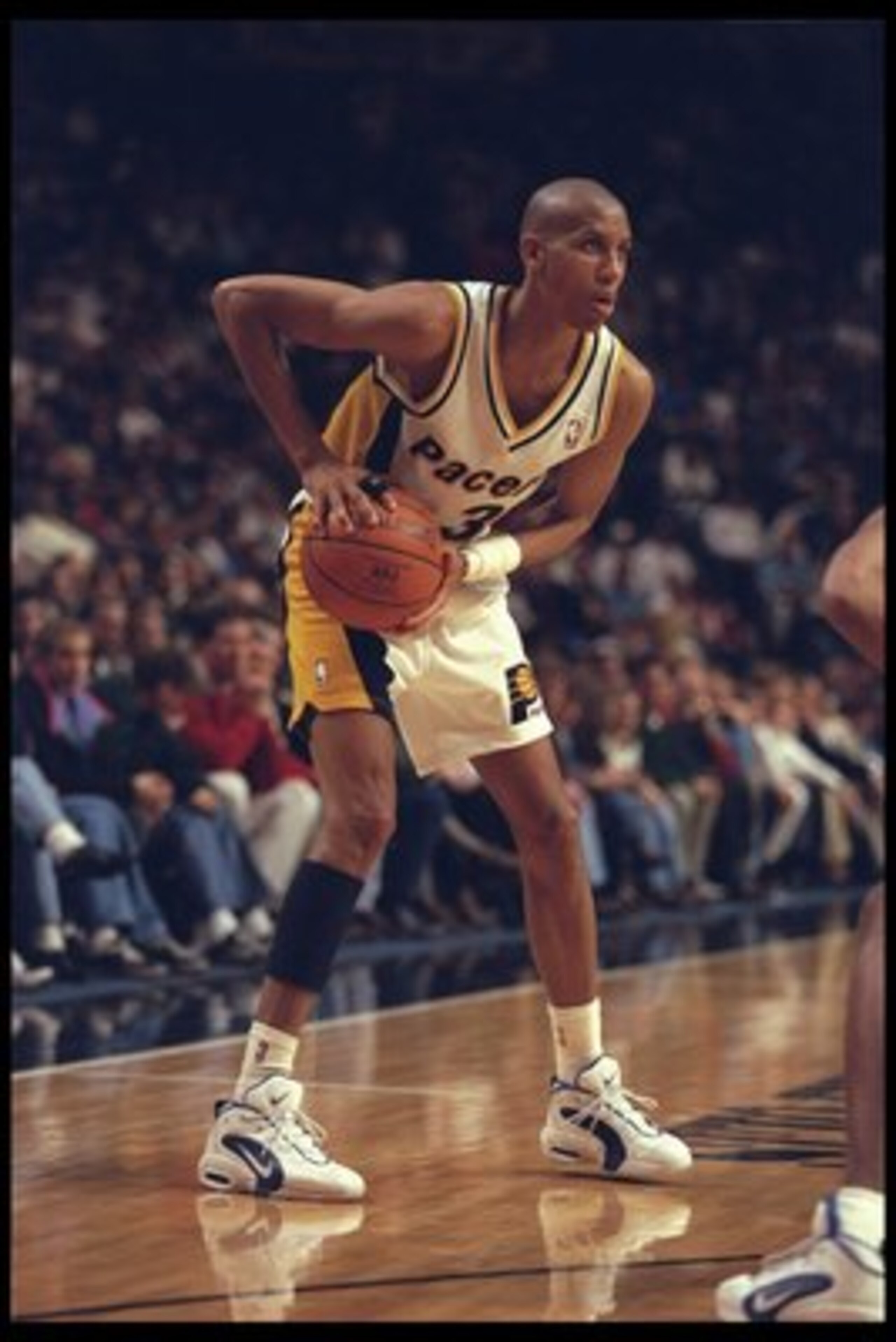 22 Dec 1995:  Guard Reggie Miller of the Indiana Pacers looks to pass against the Dallas Mavericks during a game played at Market Square Arena in Indianapolis, Indiana.  The Pacers won the game, 90-79. Mandatory Credit: ALLSPORT USA/Allsport