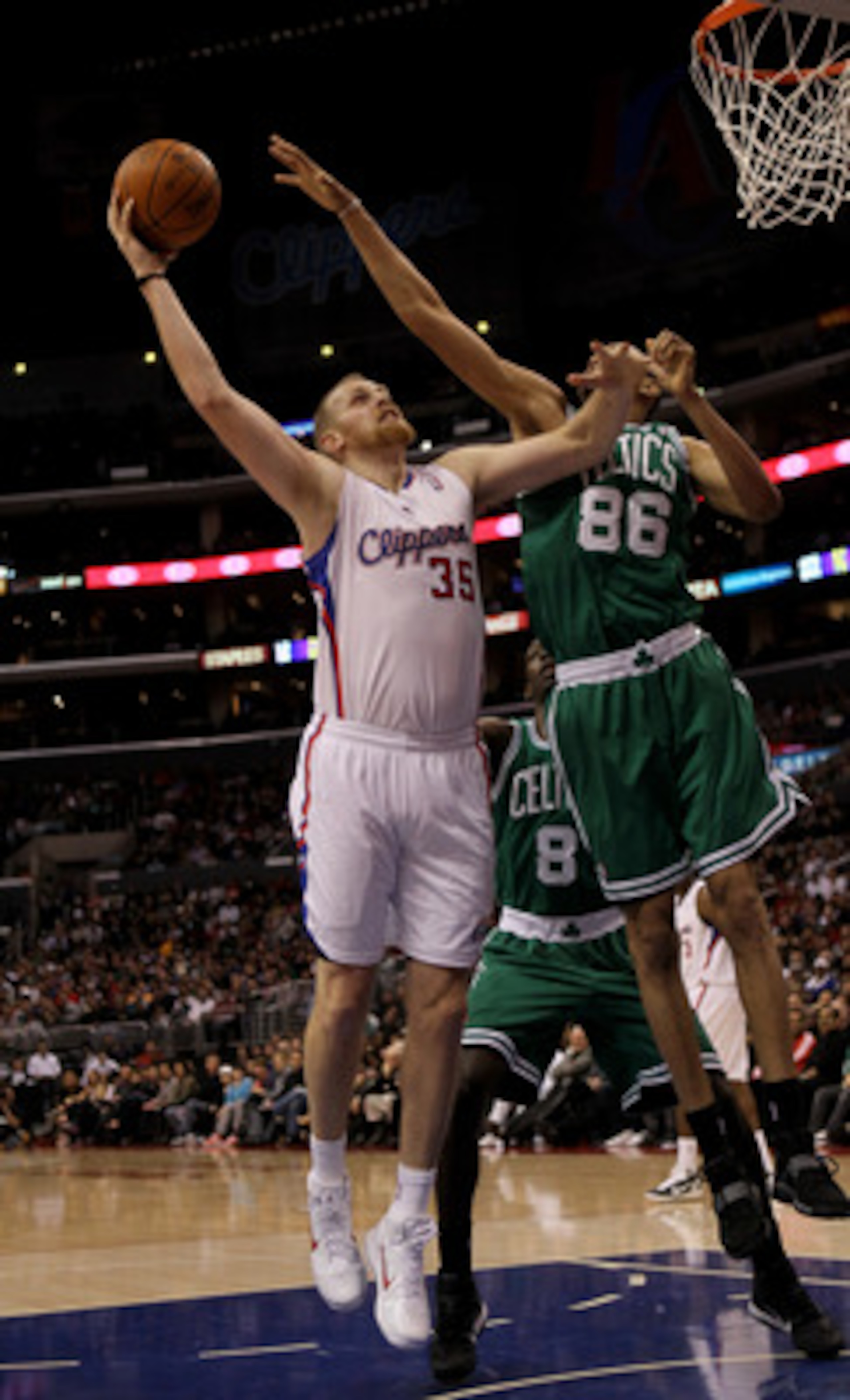 LOS ANGELES, CA - FEBRUARY 26:  Chris Kaman #35 of the Los Angeles Clippers shoots over Chris Johnson #86 of he Boston Celtics at Staples Center on February 26, 2011  in Los Angeles, California.  NOTE TO USER: User expressly acknowledges and agrees that,