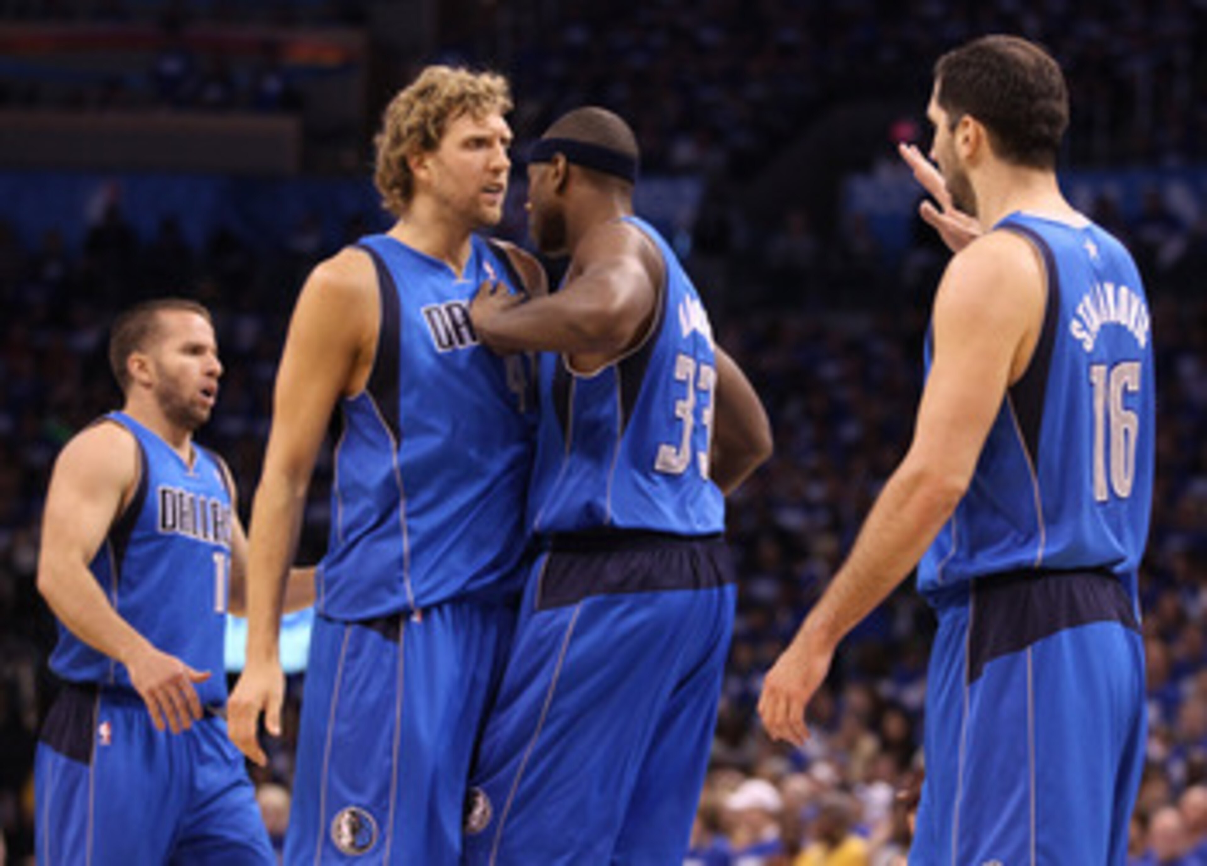 OKLAHOMA CITY, OK - MAY 21: (L-R) Jose Juan Barea #11, Dirk Nowitzki #41, Brendan Haywood #33, and Peja Stojakovic #16 of the Dallas Mavericks celebrate in the second quarter while taking on the Oklahoma City Thunder in Game Three of the Western Conferen OKLAHOMA CITY, OK - MAY 21: (L-R) Jose Juan Barea #11, Dirk Nowitzki #41, Brendan Haywood #33, and Peja Stojakovic #16 of the Dallas Mavericks celebrate in the second quarter while taking on the Oklahoma City Thunder in Game Three of the Western Conferen