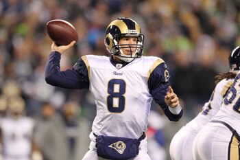 SEATTLE, WA - JANUARY 02:  Quarterback Sam Bradford #8 of the St. Louis Rams looks to pass against the Seattle Seahawks during their game at Qwest Field on January 2, 2011 in Seattle, Washington.  (Photo by Otto Greule Jr/Getty Images)