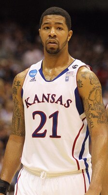 SAN ANTONIO, TX - MARCH 27:  Markieff Morris #21 and Marcus Morris #22 of the Kansas Jayhawks react during the southwest regional final of the 2011 NCAA men's basketball tournament against the Virginia Commonwealth Rams at the Alamodome on March 27, 2011 