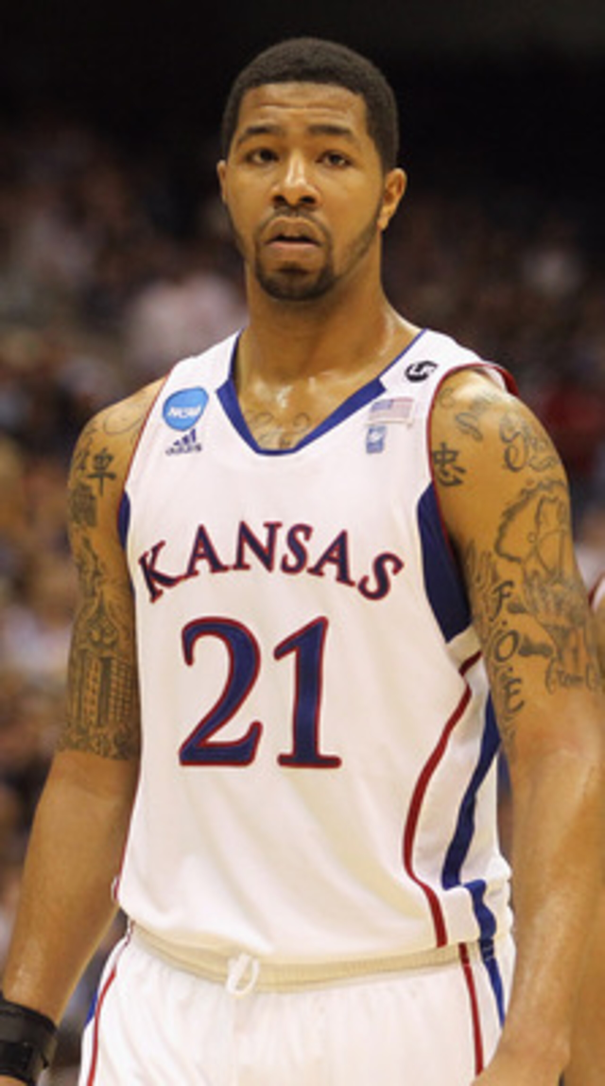 SAN ANTONIO, TX - MARCH 27:  Markieff Morris #21 and Marcus Morris #22 of the Kansas Jayhawks react during the southwest regional final of the 2011 NCAA men's basketball tournament against the Virginia Commonwealth Rams at the Alamodome on March 27, 2011 