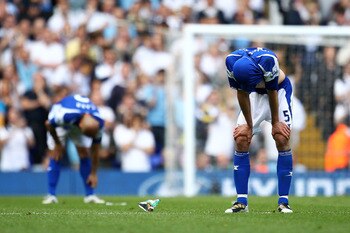 LONDON, ENGLAND - MAY 22:  Roger Johnson (R) of Birmingham City bows his head after Birmingham were relegated during the Barclays Premier League match between Tottenham Hotspur and Birmingham City at White Hart Lane on May 22, 2011 in London, England.  (P