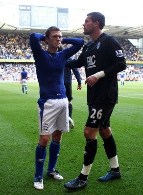 LONDON, ENGLAND - MAY 22:  Craig Gardner (L) and Ben Foster of Birmingham City look dejected after their team was relegated during the Barclays Premier League match between Tottenham Hotspur and Birmingham City at White Hart Lane on May 22, 2011 in London