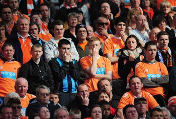 MANCHESTER, ENGLAND - MAY 22:  Blackpool fans look dejected during the Barclays Premier League match between Manchester United and Blackpool at Old Trafford on May 22, 2011 in Manchester, England.  (Photo by Shaun Botterill/Getty Images)