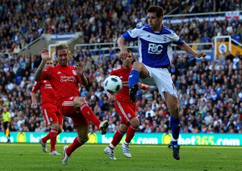 BIRMINGHAM, ENGLAND - SEPTEMBER 12:  Raul Meireles of Liverpool challenges Scott Dann of Birmingham City during the Barclays Premier League match between Birmingham City and Liverpool at St Andrew's Stadium on September 12, 2010 in Birmingham, England. (P