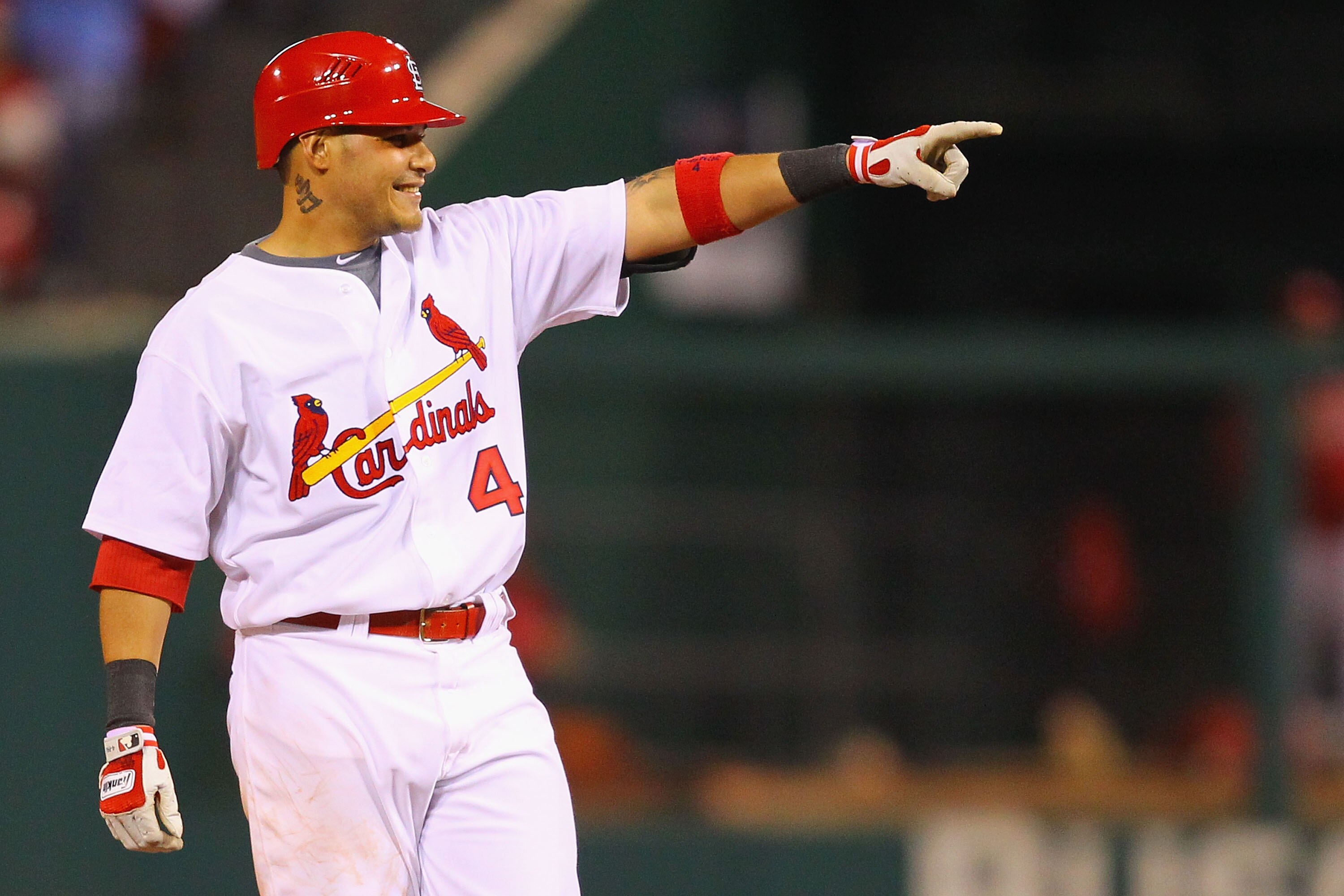 ST. LOUIS, MO - MAY 17: Yadier Molina #4 of the St. Louis Cardinals acknowledges the dugout after hitting a single against the Philadelphia Phillies at Busch Stadium on May 17, 2011 in St. Louis, Missouri.  (Photo by Dilip Vishwanat/Getty Images)