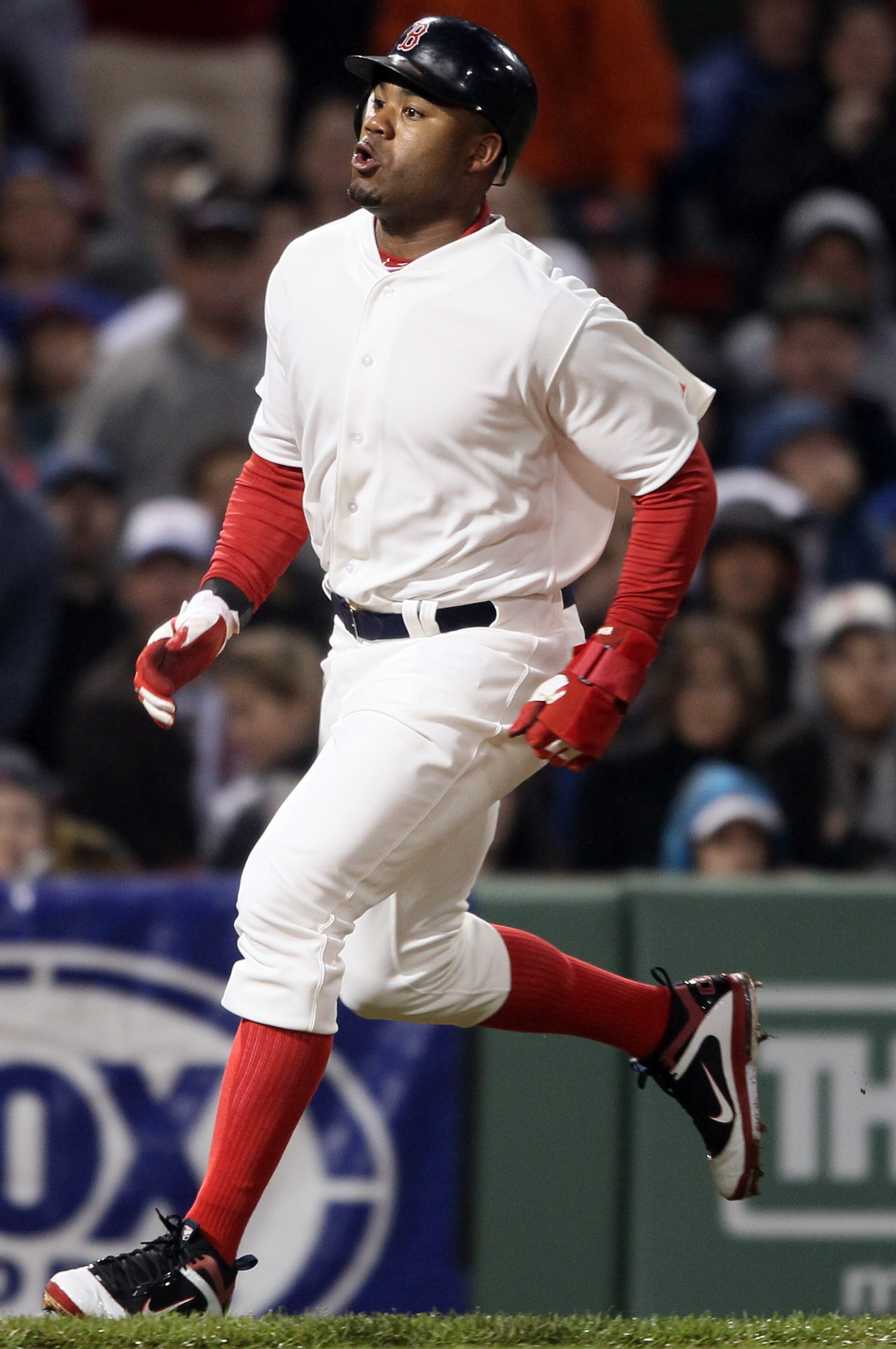 BOSTON, MA - MAY 21:  Carl Crawford #13 of the Boston Red Sox scores a run in the sixth inning against the Chicago Cubs on May 21, 2011 at Fenway Park in Boston, Massachusetts. Tonight the Chicago Cubs and the Boston Red Sox are wearing replica uniforms f