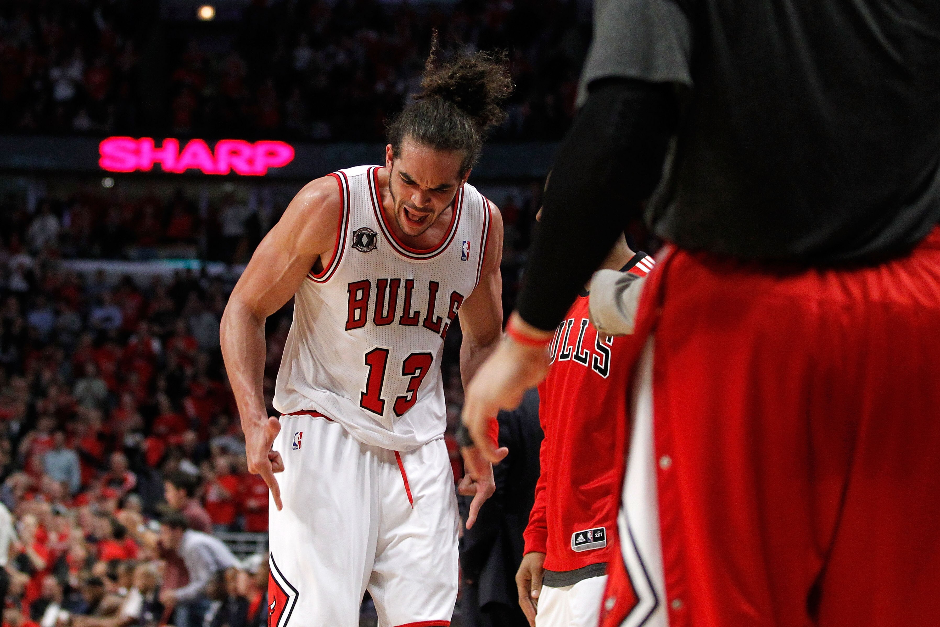 CHICAGO, IL - MAY 15:  Joakim Noah #13 of the Chicago Bulls reacts as he walks back towards the bench against the Miami Heat in Game One of the Eastern Conference Finals during the 2011 NBA Playoffs on May 15, 2011 at the United Center in Chicago, Illinoi