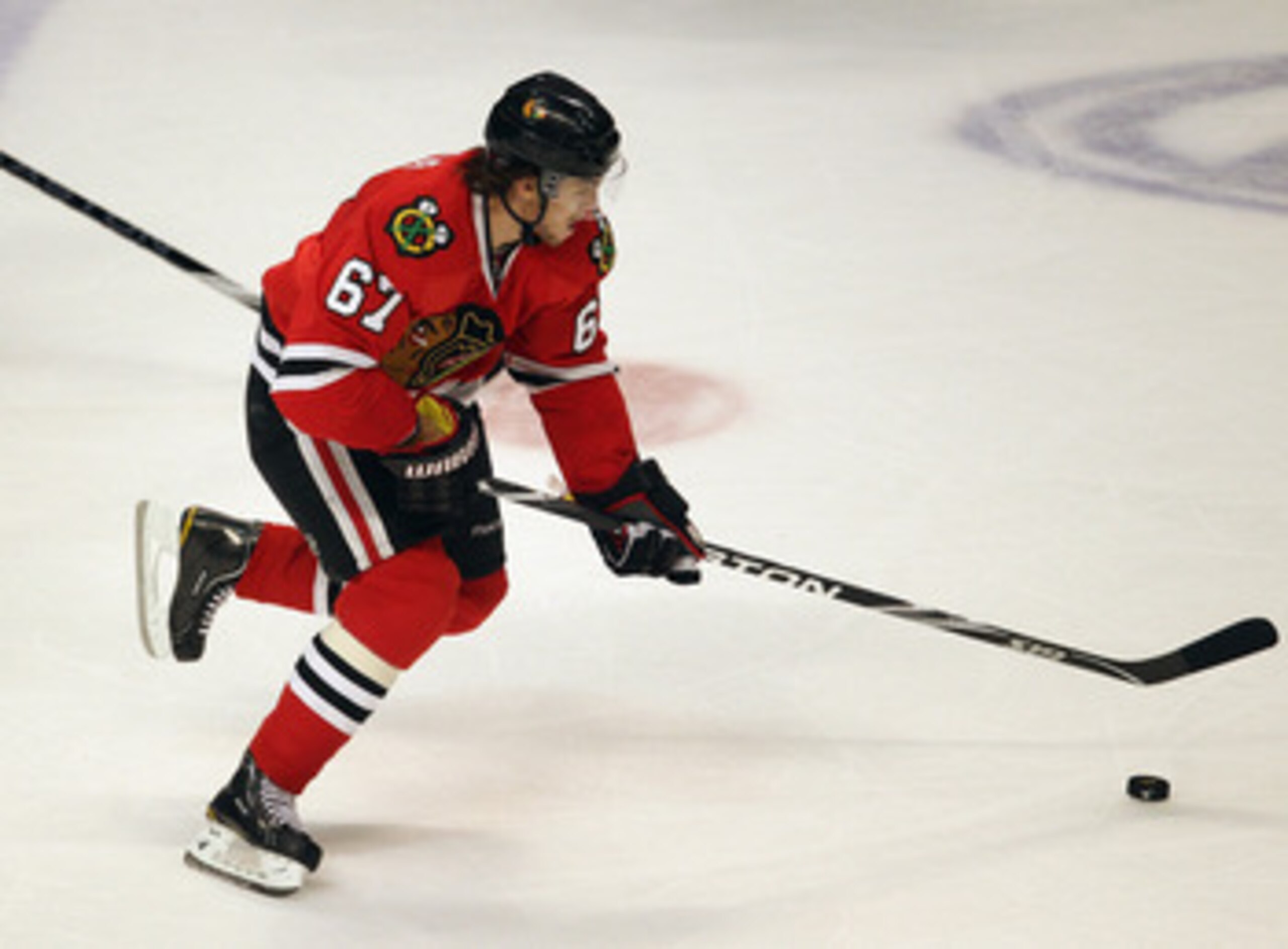 CHICAGO, IL - APRIL 19:Michael frolik #67 of the Chicago Blackhawks skates up the ice against the Vancouver Canucks in Game Four of the Western Conference Quarterfinals during the 2011 NHL Stanley Cup Playoffs at the United Center on April 19, 2011 in Chi