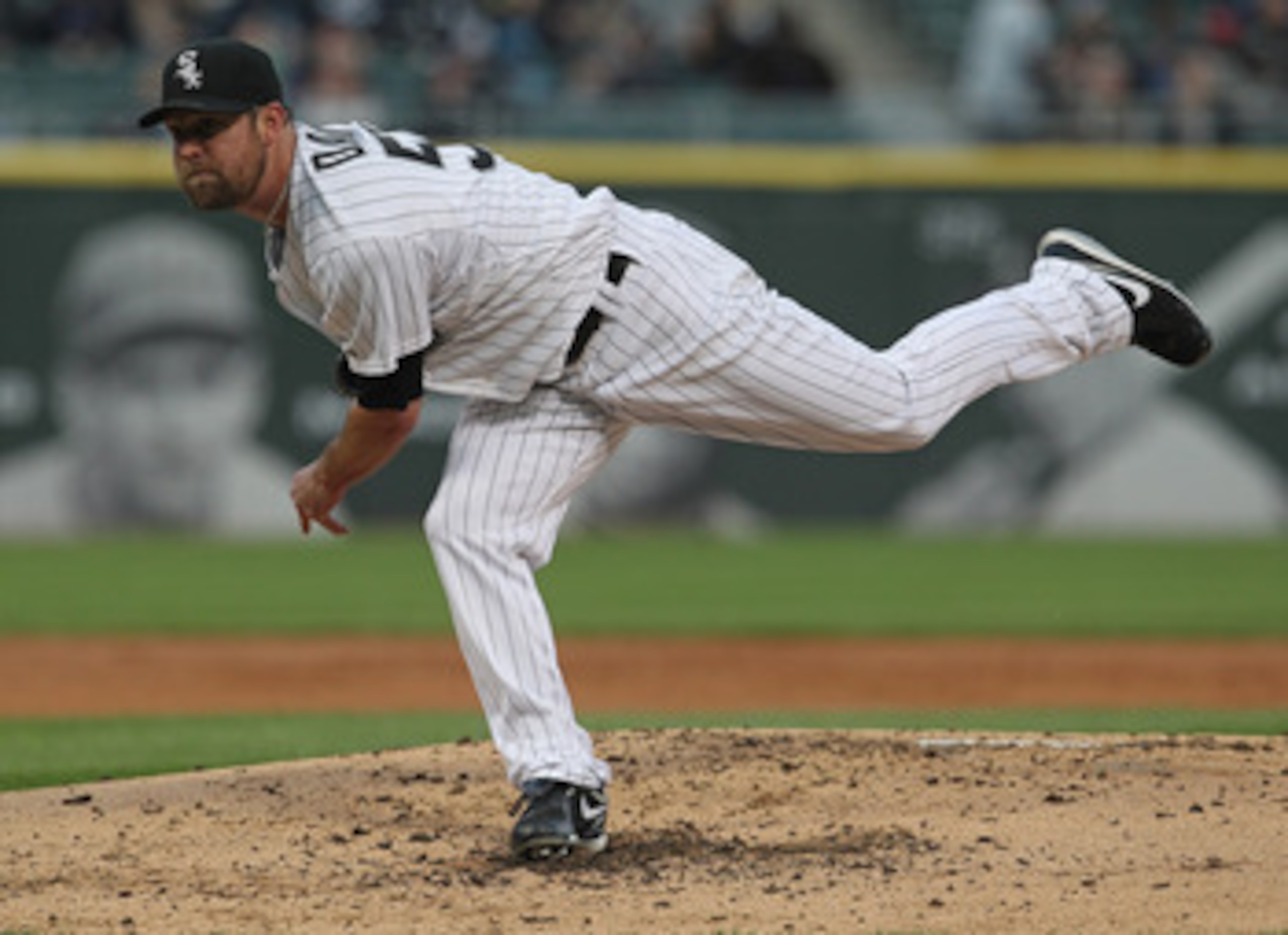 CHICAGO, IL - MAY 17: Starting pitcher John Danks #50 of the Chicago White Sox follows through after throwing a pitch against the Texas Rangers at U.S. Cellular Field on May 17, 2011 in Chicago, Illinois.  The White Sox defeated the Rangers 4-3. (Photo by