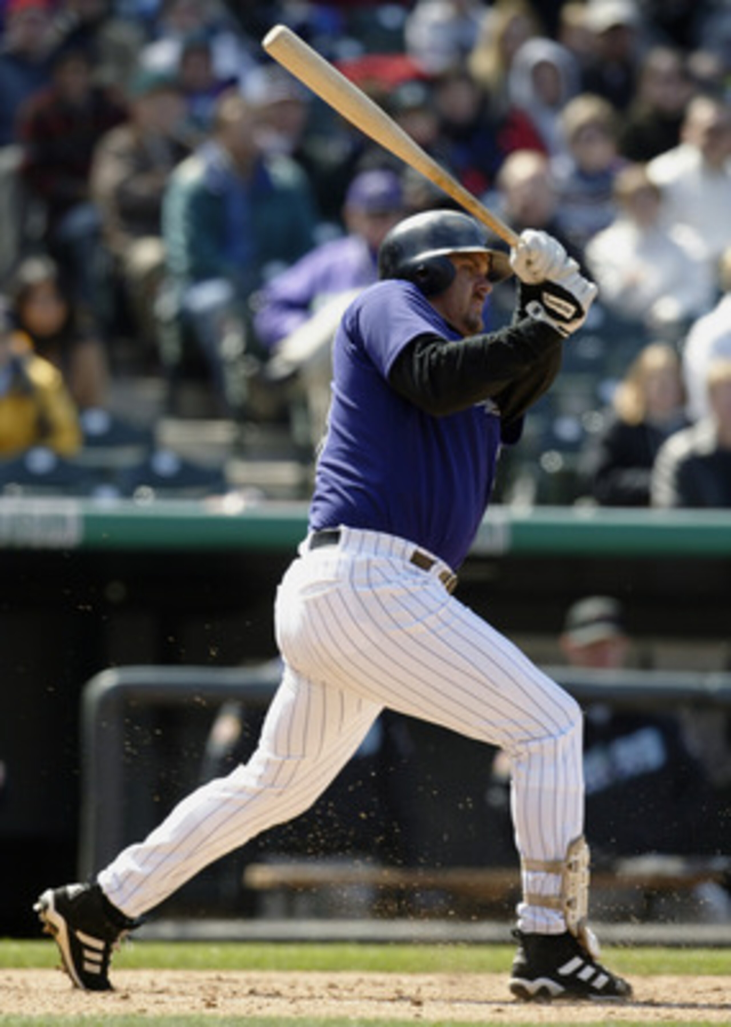 DENVER - APRIL 6: Right fielder Larry Walker #33 of the Colorado Rockies puts the ball in play during the game against the Arizona Diamondbacks at Coors Field on April 6, 2003 in Denver, Colorado. The Rockies defeated the Diamondbacks 8-3. (Photo by Br DENVER - APRIL 6: Right fielder Larry Walker #33 of the Colorado Rockies puts the ball in play during the game against the Arizona Diamondbacks at Coors Field on April 6, 2003 in Denver, Colorado. The Rockies defeated the Diamondbacks 8-3. (Photo by Br
