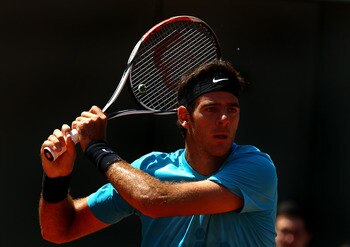 PARIS, FRANCE - MAY 23:  Juan Martin Del Potro of Argentina plays a backhand during the men's singles first round match between Juan Martin Del Potro of Argentina and Ivo Karlovic of Croatia on day two of the French Open at Roland Garros on May 23, 2011 i