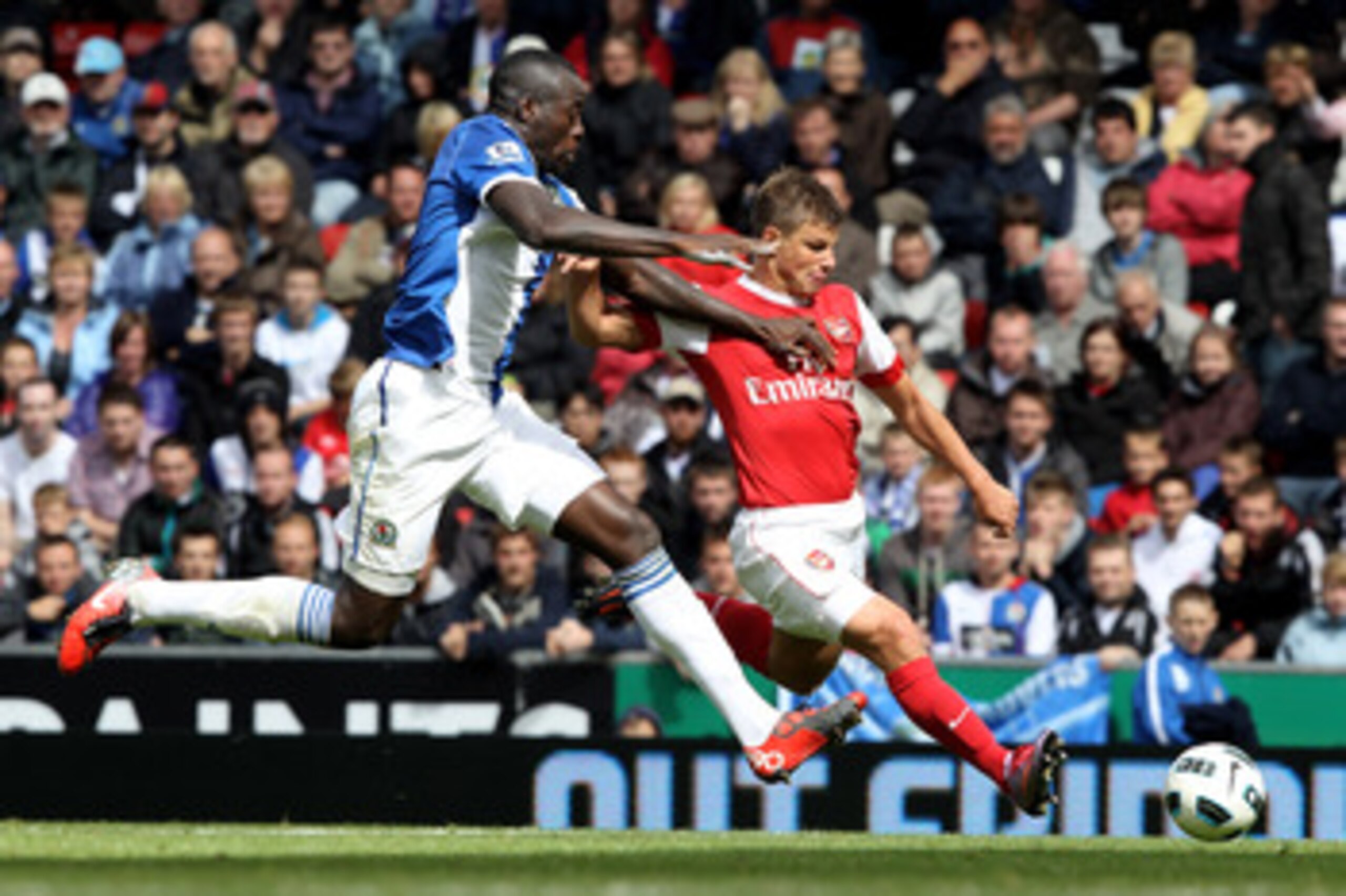 BLACKBURN, ENGLAND - AUGUST 28:  Andrey Arshavin of Arsenal is challenged by Chris Samba of Blackburn Rovers during the Barclays Premier League match between Blackburn Rovers and Arsenal at Ewood Park on August 28, 2010 in Blackburn, England.  (Photo by C