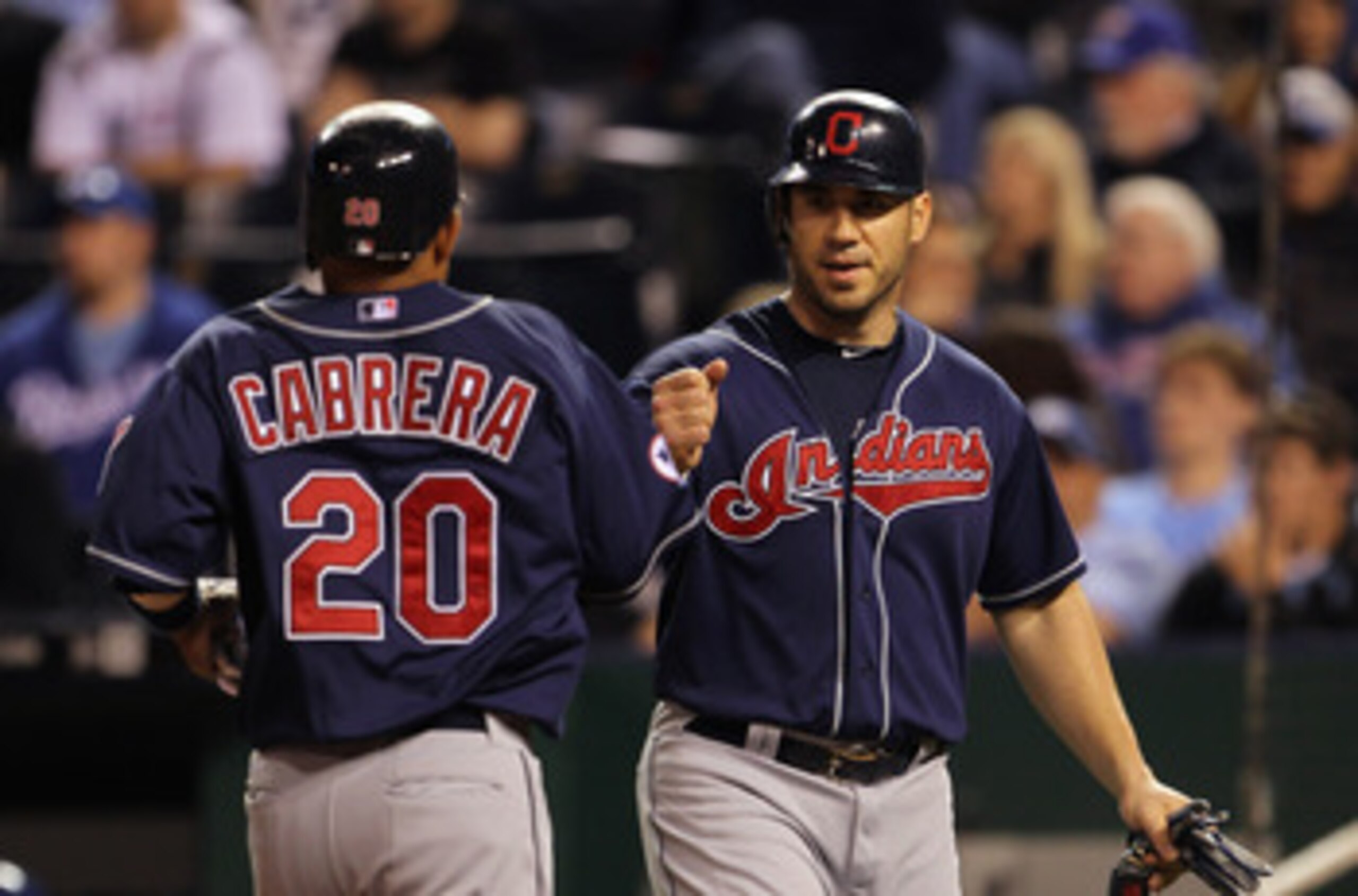 KANSAS CITY, MO - MAY 16: Orlando Cabrera #20 of the Cleveland Indians is congratulated by Travis Hafner #48 after scoring during the game against the Kansas City Royals on May 16, 2011 at Kauffman Stadium in Kansas City, Missouri. (Photo by Jamie Squir KANSAS CITY, MO - MAY 16: Orlando Cabrera #20 of the Cleveland Indians is congratulated by Travis Hafner #48 after scoring during the game against the Kansas City Royals on May 16, 2011 at Kauffman Stadium in Kansas City, Missouri. (Photo by Jamie Squir