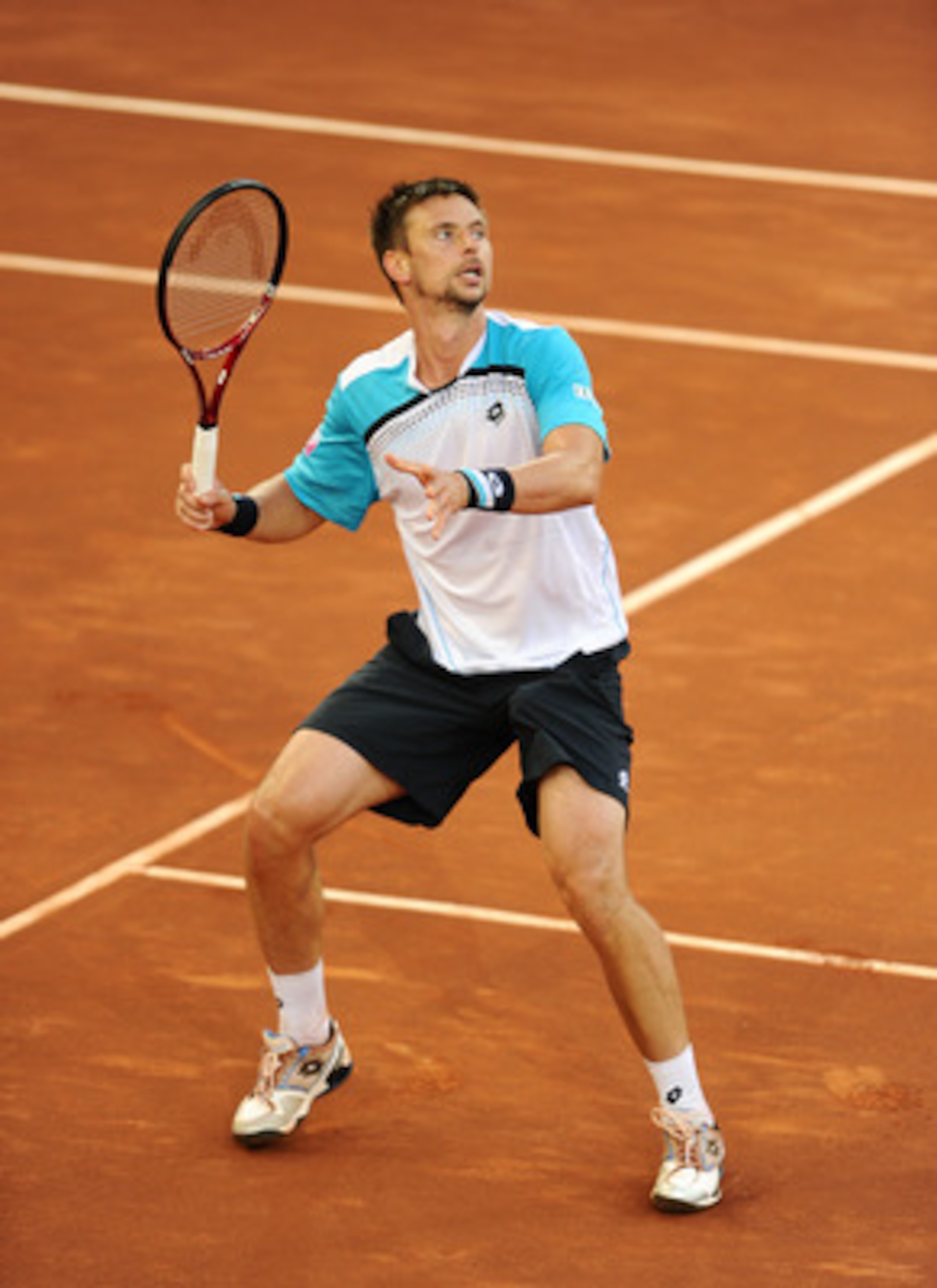 MADRID, SPAIN - MAY 06:  Robin Soderling of Sweden follows a high ball in his match against Roger Federer of Switzerland during day seven of the Mutua Madrilena Madrid Open Tennis on May 6, 2011 in Madrid, Spain. Federer won the match in straight sets.  (