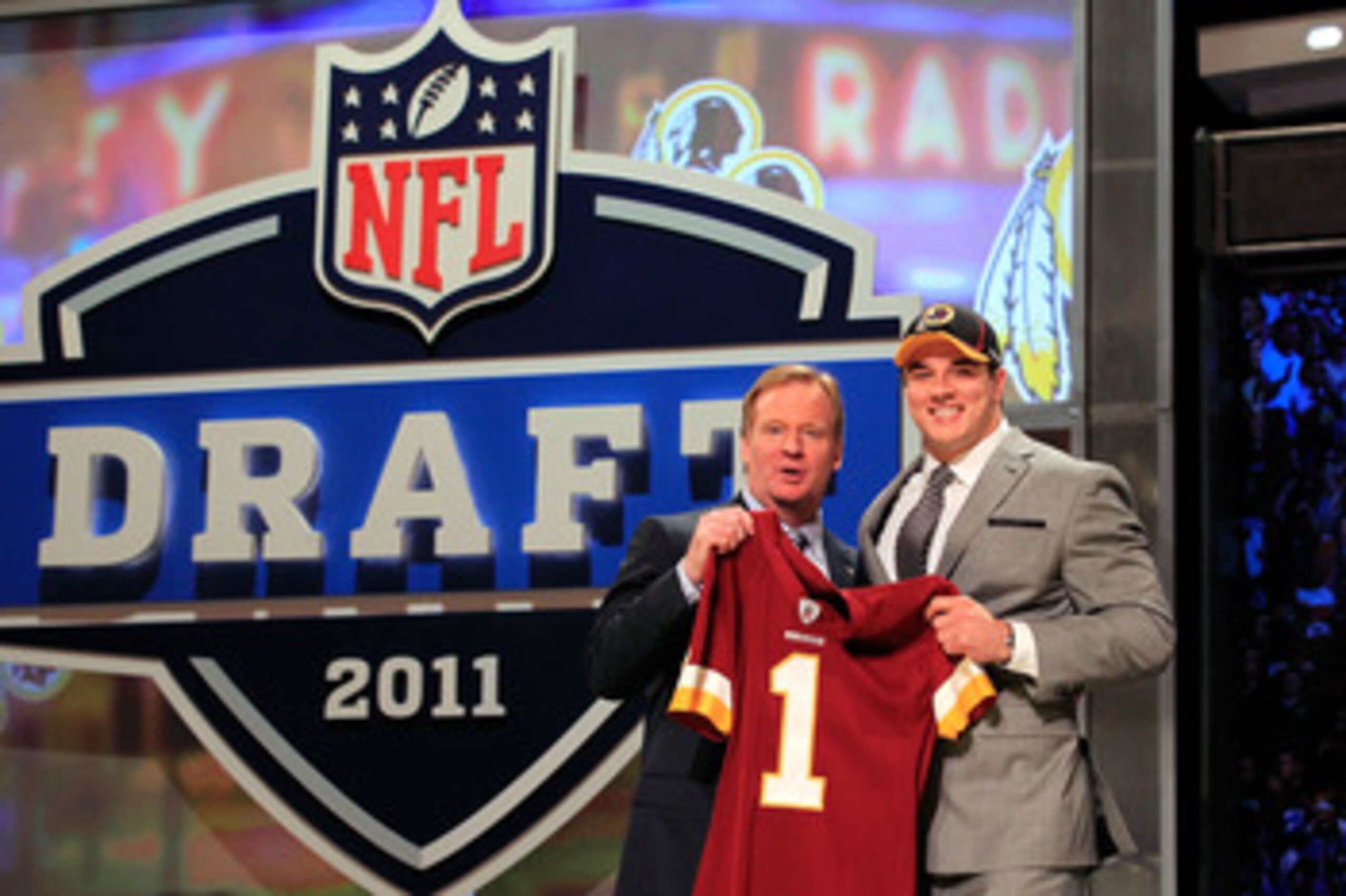 NEW YORK, NY - APRIL 28:  NFL Commissioner Roger Goodell (L) poses for a photo with Ryan Kerrigan, #16 overall pick by the Washington Redskins, on stage during the 2011 NFL Draft at Radio City Music Hall on April 28, 2011 in New York City.  (Photo by Chri