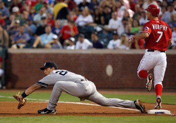 ARLINGTON, TX - SEPTEMBER 10:  Baserunner David Murphy #7 of the Texas Rangers beats the throw against first baseman Mark Teixeria #25 of the New York Yankees on September 10, 2010 at Rangers Ballpark in Arlington, Texas.  (Photo by Tom Pennington/Getty I