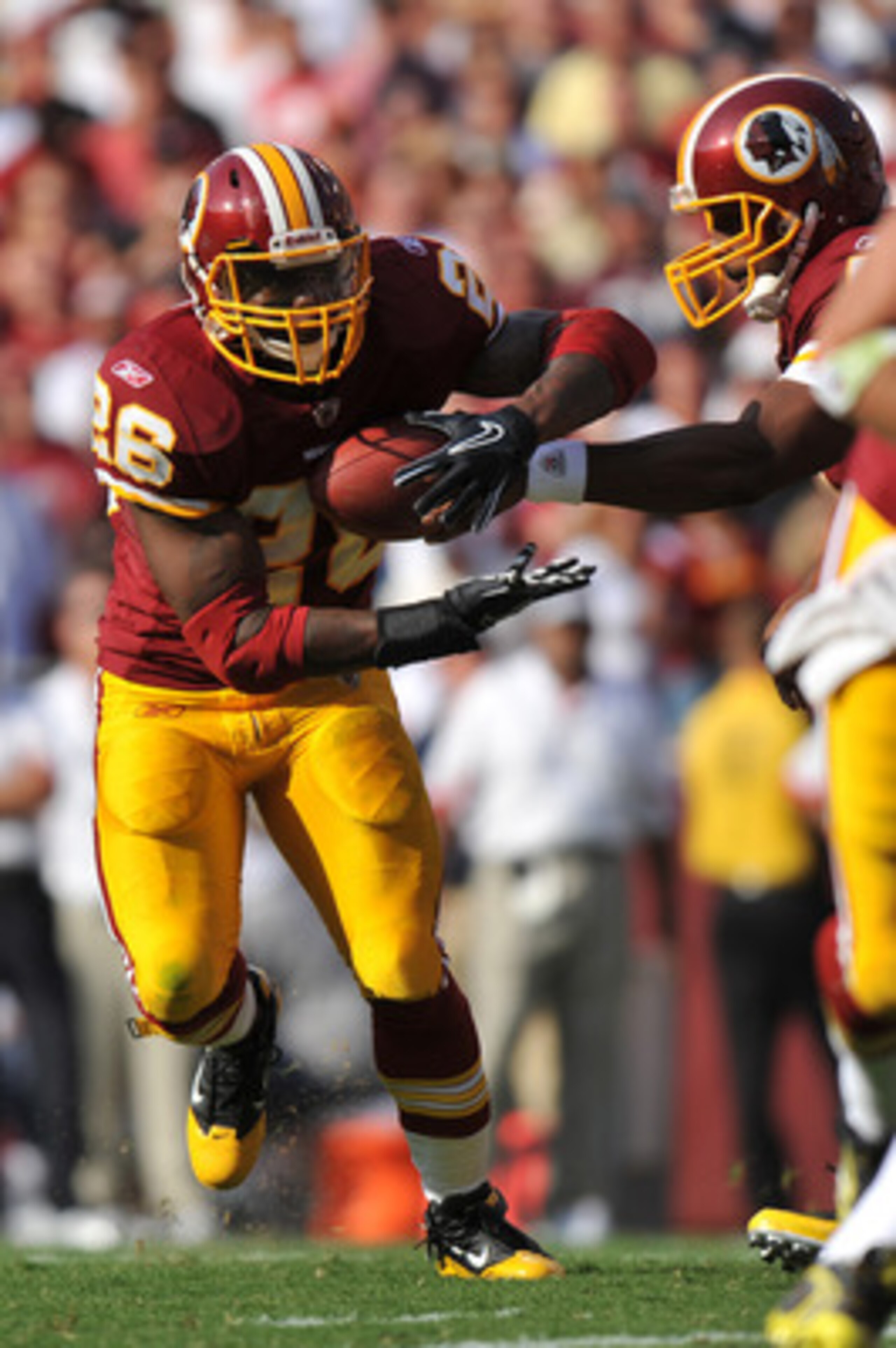 LANDOVER, MD - SEPTEMBER 19:  Clinton Portis #26 of the Washington Redskins runs22 the ball during the game against the Houston Texans at FedExField on September 19, 2010 in Landover, Maryland. The Texans defeated the Redskins in overtime 30-27. (Photo by