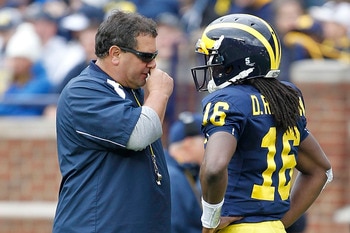ANN ARBOR, MI - APRIL 16:  Head football coach Brady Hoke talks with Denard Robinson #16 during the annual Spring Game at Michigan Stadium on April 16, 2011 in Ann Arbor, Michigan.  (Photo by Leon Halip/Getty Images)