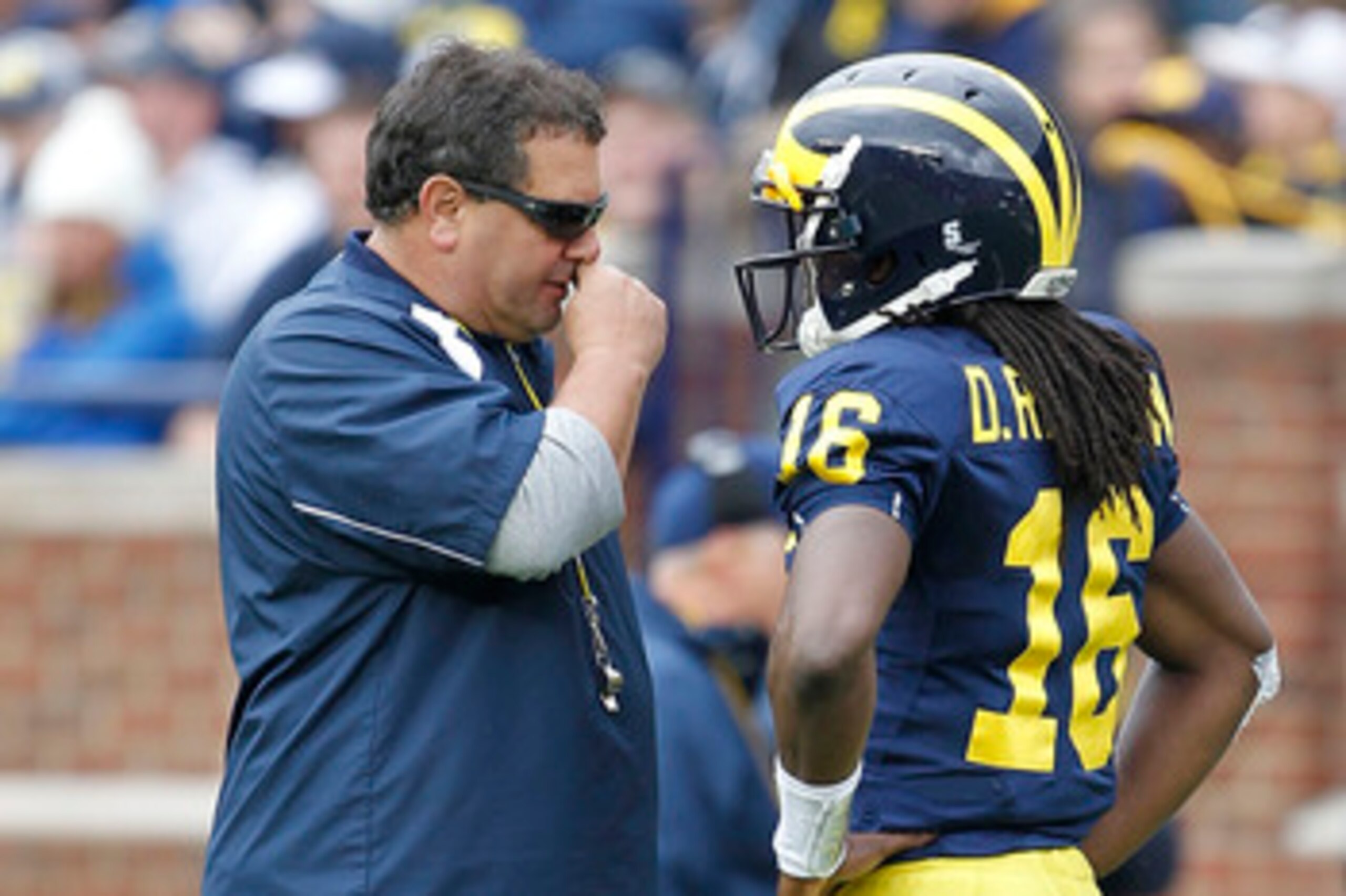 ANN ARBOR, MI - APRIL 16: Head football coach Brady Hoke talks with Denard Robinson #16 during the annual Spring Game at Michigan Stadium on April 16, 2011 in Ann Arbor, Michigan. (Photo by Leon Halip/Getty Images) ANN ARBOR, MI - APRIL 16: Head football coach Brady Hoke talks with Denard Robinson #16 during the annual Spring Game at Michigan Stadium on April 16, 2011 in Ann Arbor, Michigan. (Photo by Leon Halip/Getty Images)