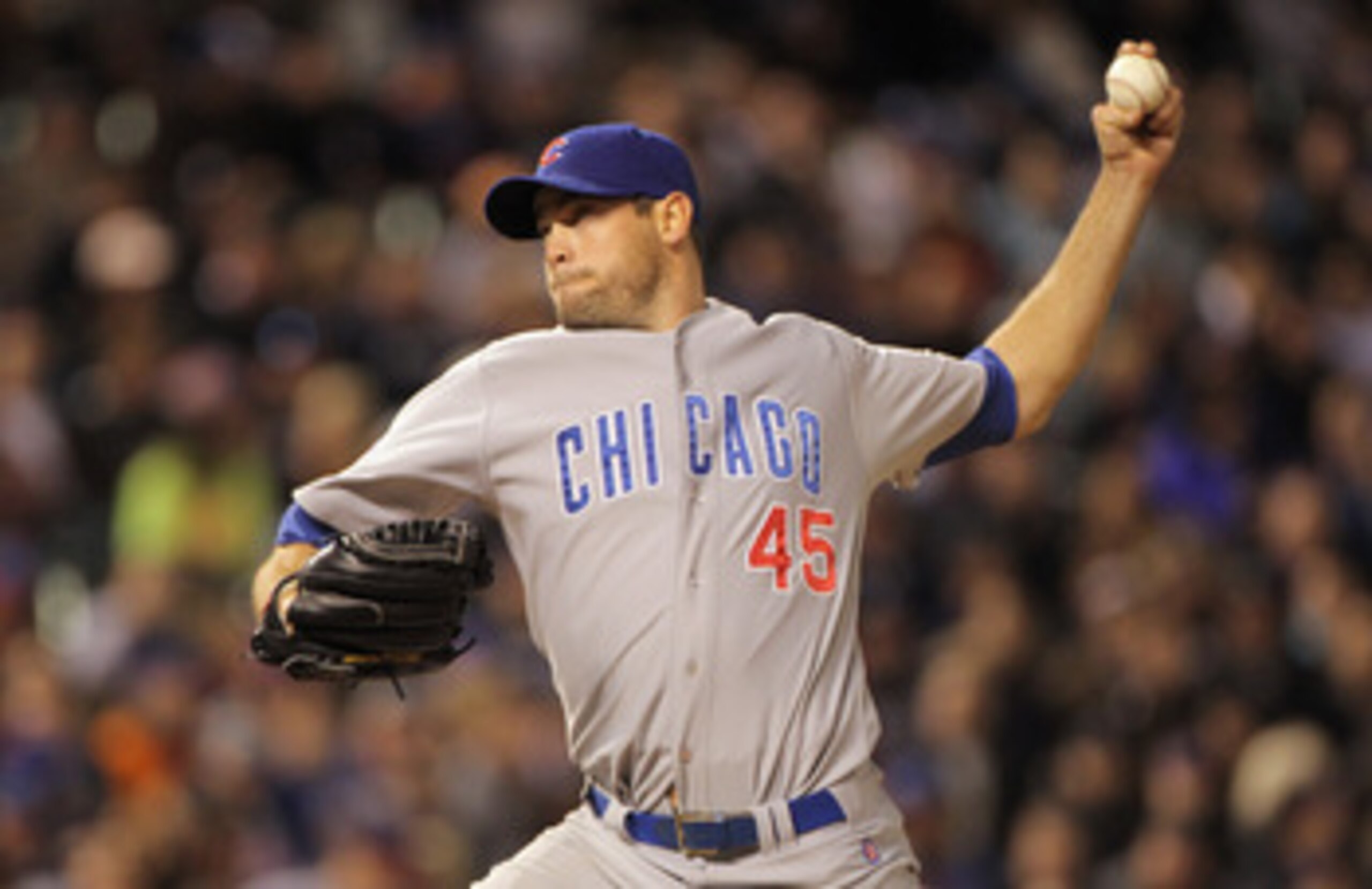 DENVER, CO - APRIL 16:  Relief pitcher Sean Marshall #45 of the Chicago Cubs delivers against the Colorado Rockies at Coors Field on April 16, 2011 in Denver, Colorado.  (Photo by Doug Pensinger/Getty Images)