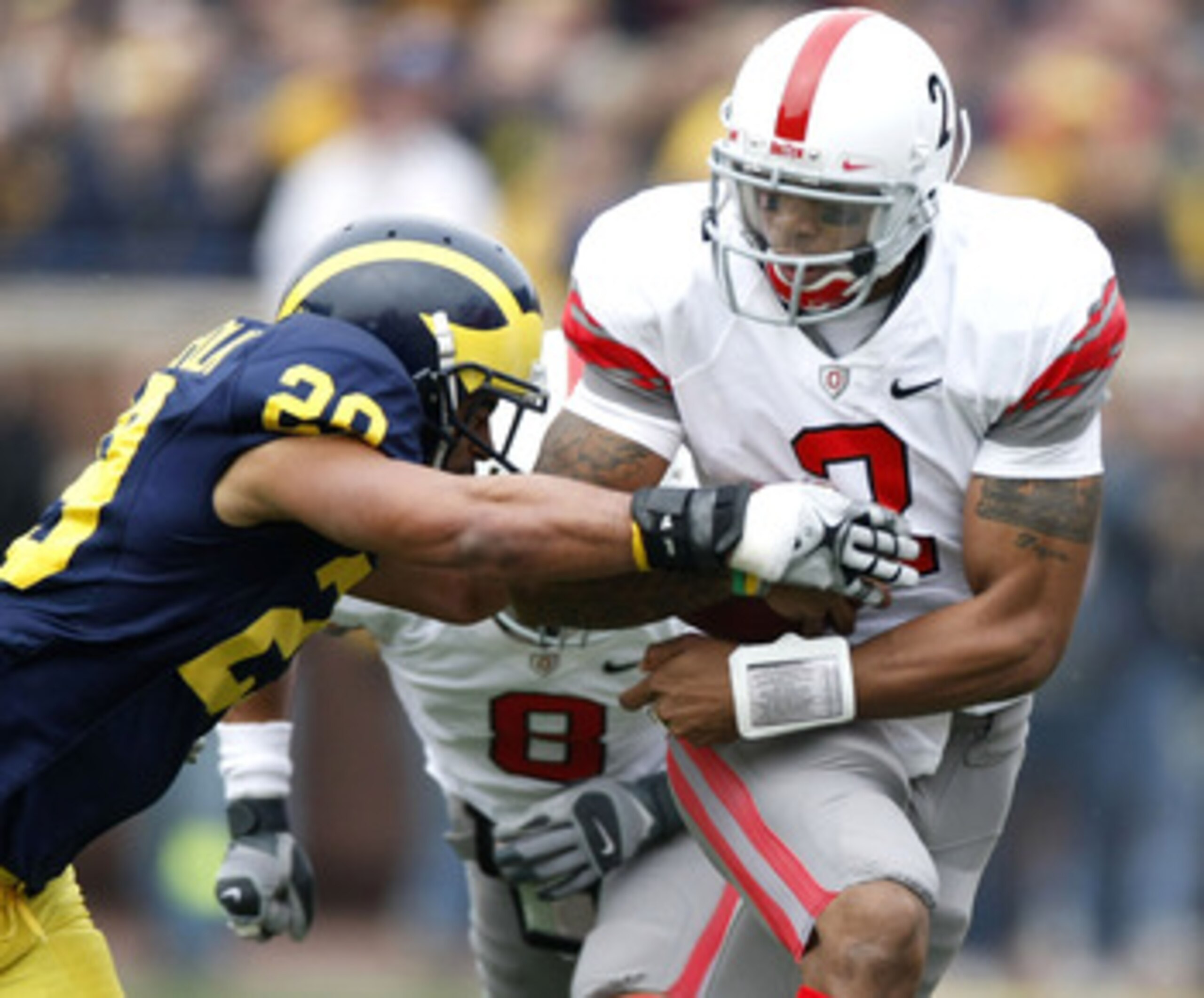 ANN ARBOR, MI - NOVEMBER 21: Terrelle Pryor #2 of the Ohio State Buckeyes tries to get around Troy Woolfolk #29 of the Michigan Wolverines on November 21, 2009 at Michigan Stadium in Ann Arbor, Michigan. (Photo by Gregory Shamus/Getty Images) ANN ARBOR, MI - NOVEMBER 21: Terrelle Pryor #2 of the Ohio State Buckeyes tries to get around Troy Woolfolk #29 of the Michigan Wolverines on November 21, 2009 at Michigan Stadium in Ann Arbor, Michigan. (Photo by Gregory Shamus/Getty Images)