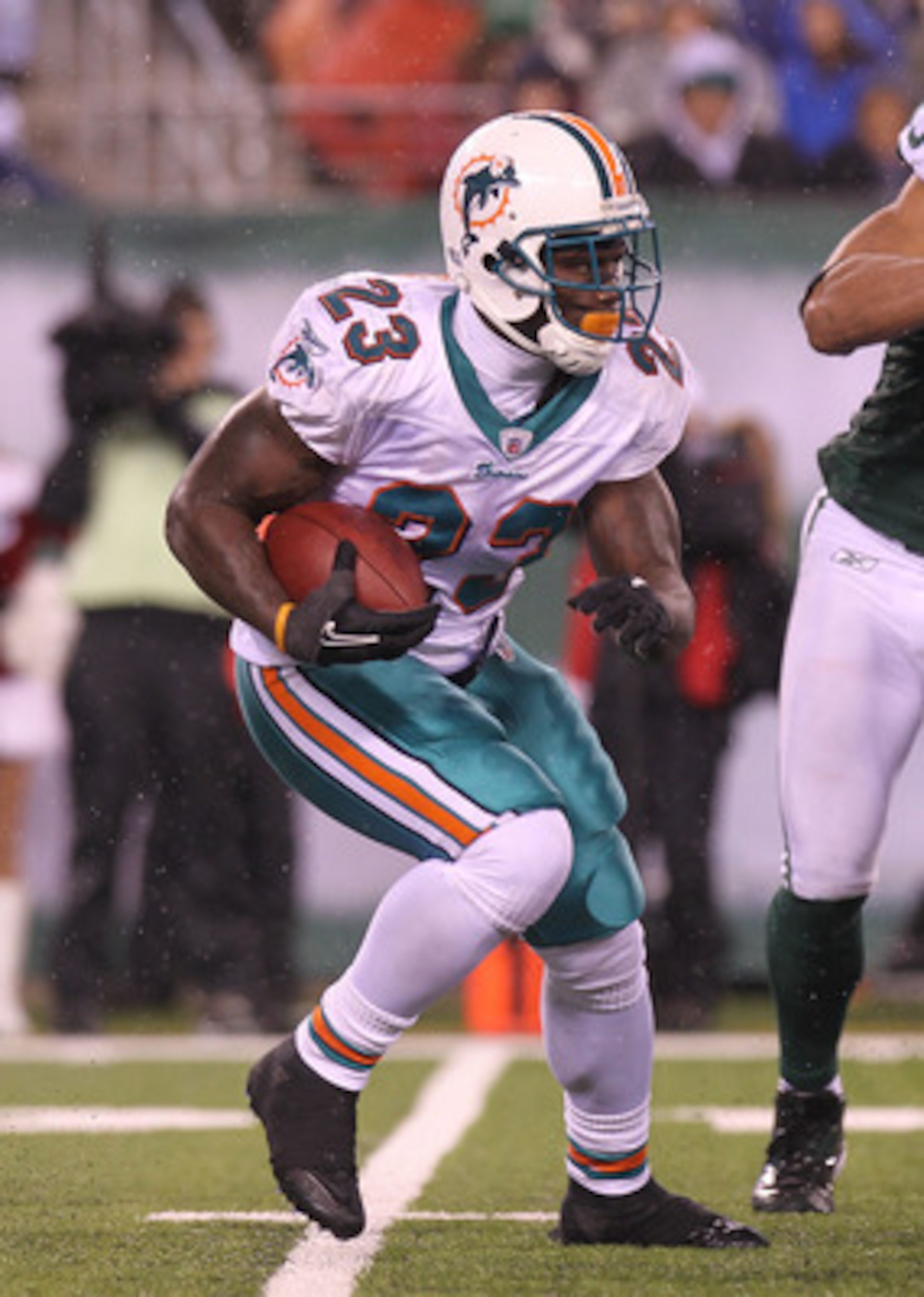 EAST RUTHERFORD, NJ - DECEMBER 12: Ronnie Brown #23 of the Miami Dolphins rushes against the New York Jets at New Meadowlands Stadium on December 12, 2010 in East Rutherford, New Jersey. (Photo by Nick Laham/Getty Images) EAST RUTHERFORD, NJ - DECEMBER 12: Ronnie Brown #23 of the Miami Dolphins rushes against the New York Jets at New Meadowlands Stadium on December 12, 2010 in East Rutherford, New Jersey. (Photo by Nick Laham/Getty Images)