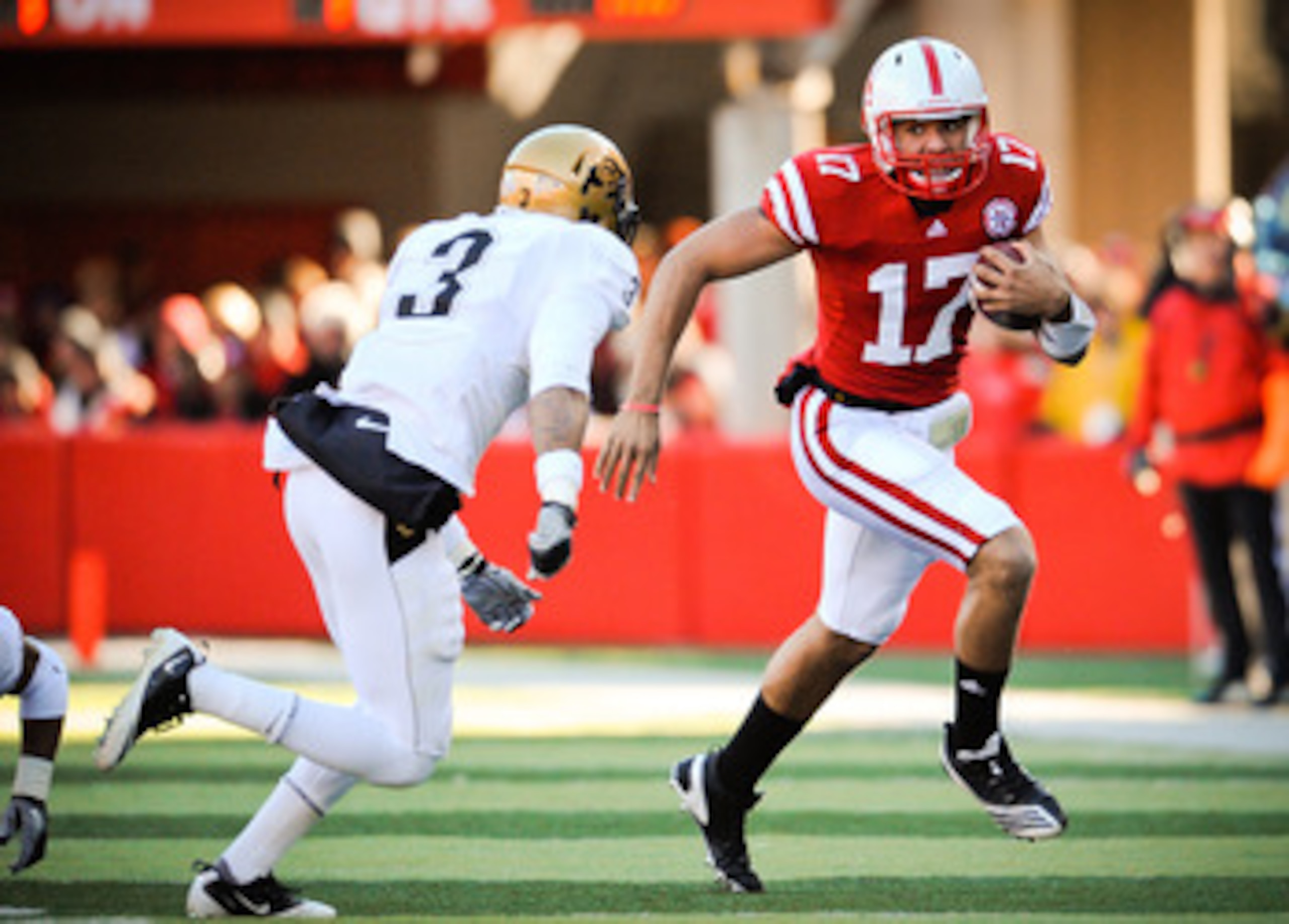 LINCOLN, NE - NOVEMBER 26: Cody Green #17 of the Nebraska Cornhuskers slips past Jimmy Smith #3 of the Colorado Buffaloes during their game at Memorial Stadium on November 26, 2010 in Lincoln, Nebraska. Nebraska defeated Colorado 45-17 (Photo by Eric Fran