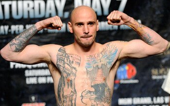 LAS VEGAS, NV - MAY 06:  Boxer Kelly Pavlik poses on the scale during the official weigh-in for his super middleweight fight against Alfonso Lopez at the MGM Grand Garden Arena May 6, 2011 in Las Vegas, Nevada.  (Photo by Ethan Miller/Getty Images)