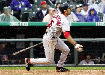 DENVER - JUNE 17:  Nomar Garciaparra #5 of the Boston Red Sox watches the path of a double against the Colorado Rockies in the seventh inning of a rainy game on June 17, 2004 at Coors Field in Denver, Colorado. Garciaparra had three hits in the Red Sox 11
