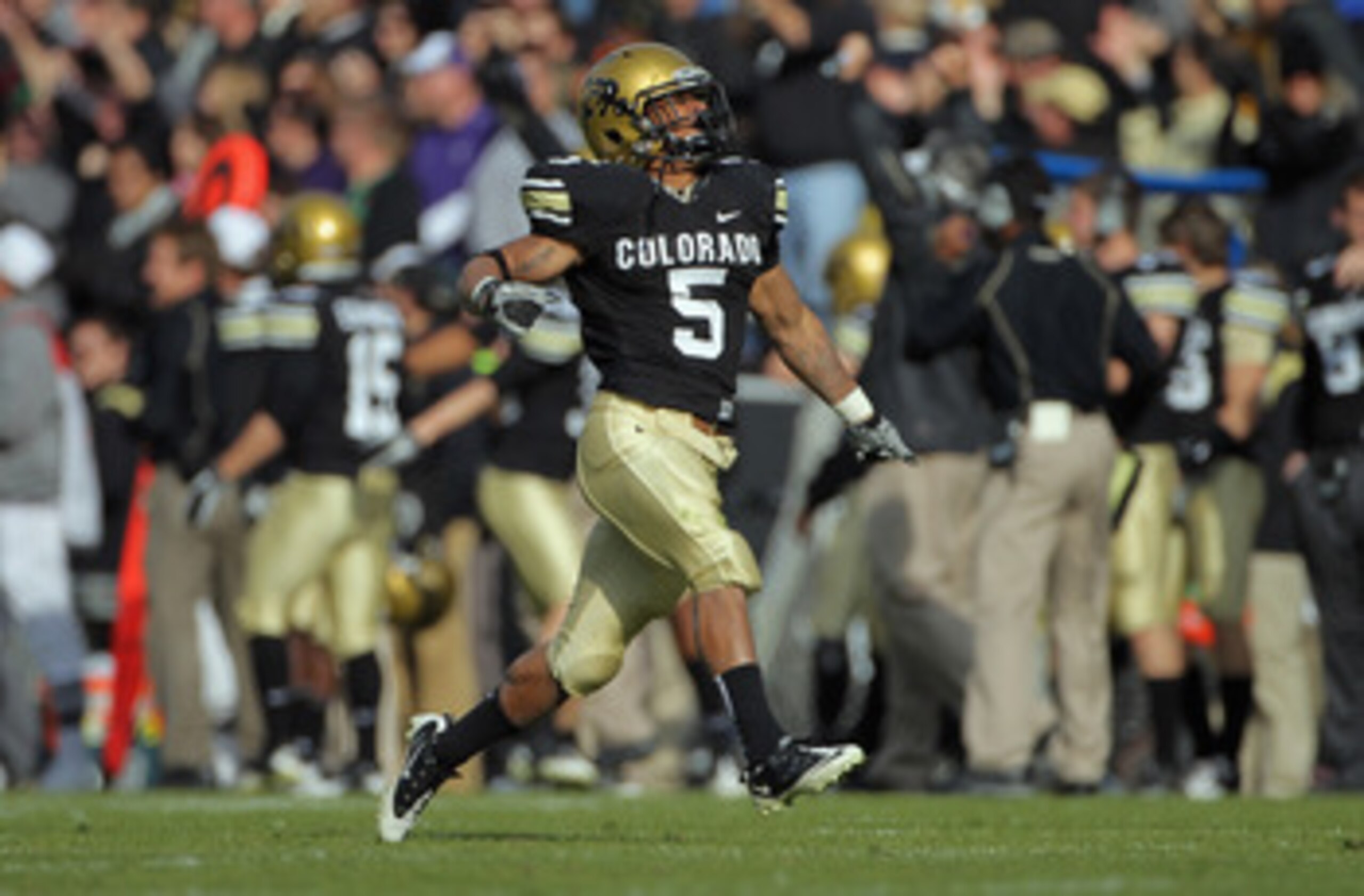 BOULDER, CO - NOVEMBER 20:  Running back Rodney Stewart #5 of the Colorado Buffaloes celebrates after he threw an option pass 23 yards to Toney Clemons for a touchdown against the Kansas State Wildcats at Folsom Field on November 20, 2010 in Boulder, Colo