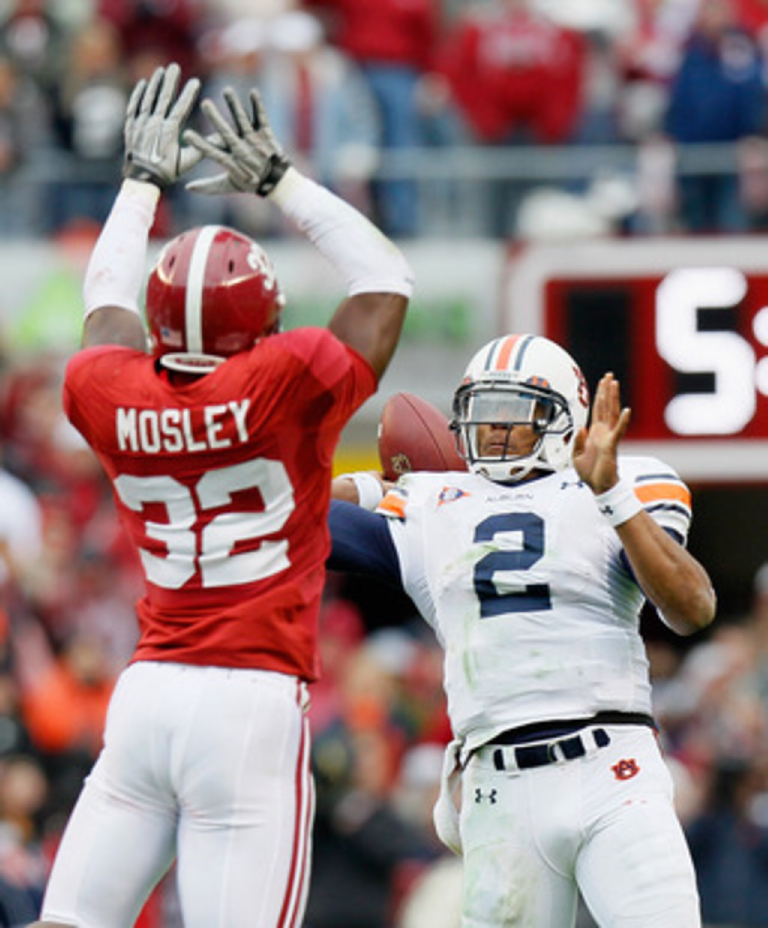 TUSCALOOSA, AL - NOVEMBER 26:  Quarterback Cam Newton #2 of the Auburn Tigers is pressured on the touchdown pass by C.J. Mosley #32 of the Alabama Crimson Tide at Bryant-Denny Stadium on November 26, 2010 in Tuscaloosa, Alabama.  (Photo by Kevin C. Cox/Ge