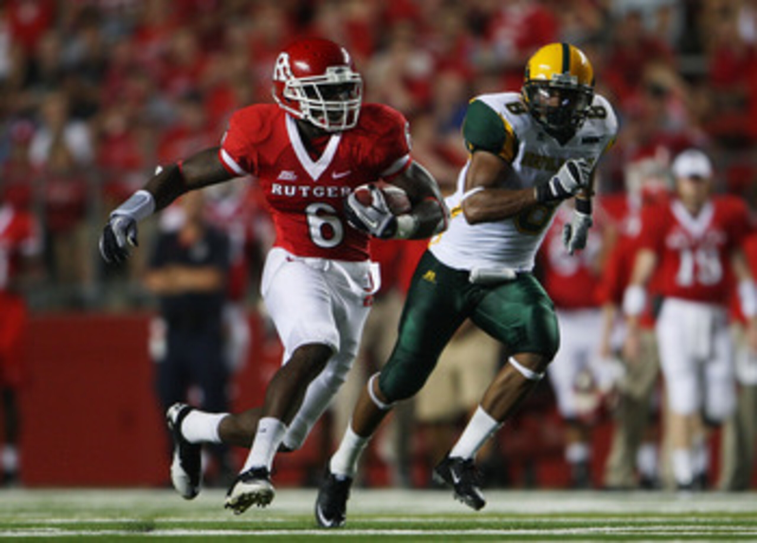 NEW BRUNSWICK, NJ - SEPTEMBER 02:  Mohamed Sanu #6 (L) of the Rutgers Scarlet Knights runs the ball against the Norfolk State Spartans at Rutgers Stadium on September 2, 2010 in New Brunswick, New Jersey. The Scarlet Knights beat the Spartans 31 - 0.  (Ph
