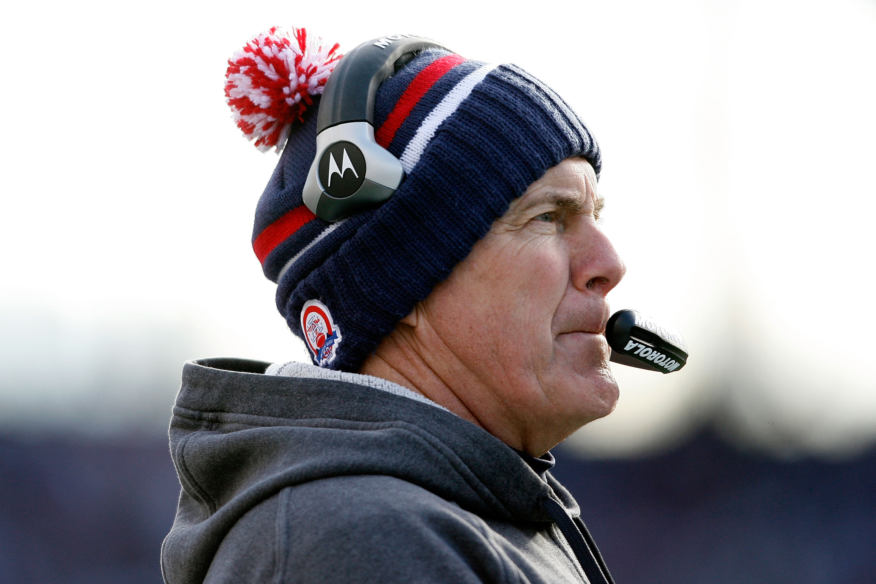 FOXBORO, MA - JANUARY 10:  Head coach Bill Belichick of the New England Patriots looks on against the Baltimore Ravens during the 2010 AFC wild-card playoff game at Gillette Stadium on January 10, 2010 in Foxboro, Massachusetts.  (Photo by Elsa/Getty Imag