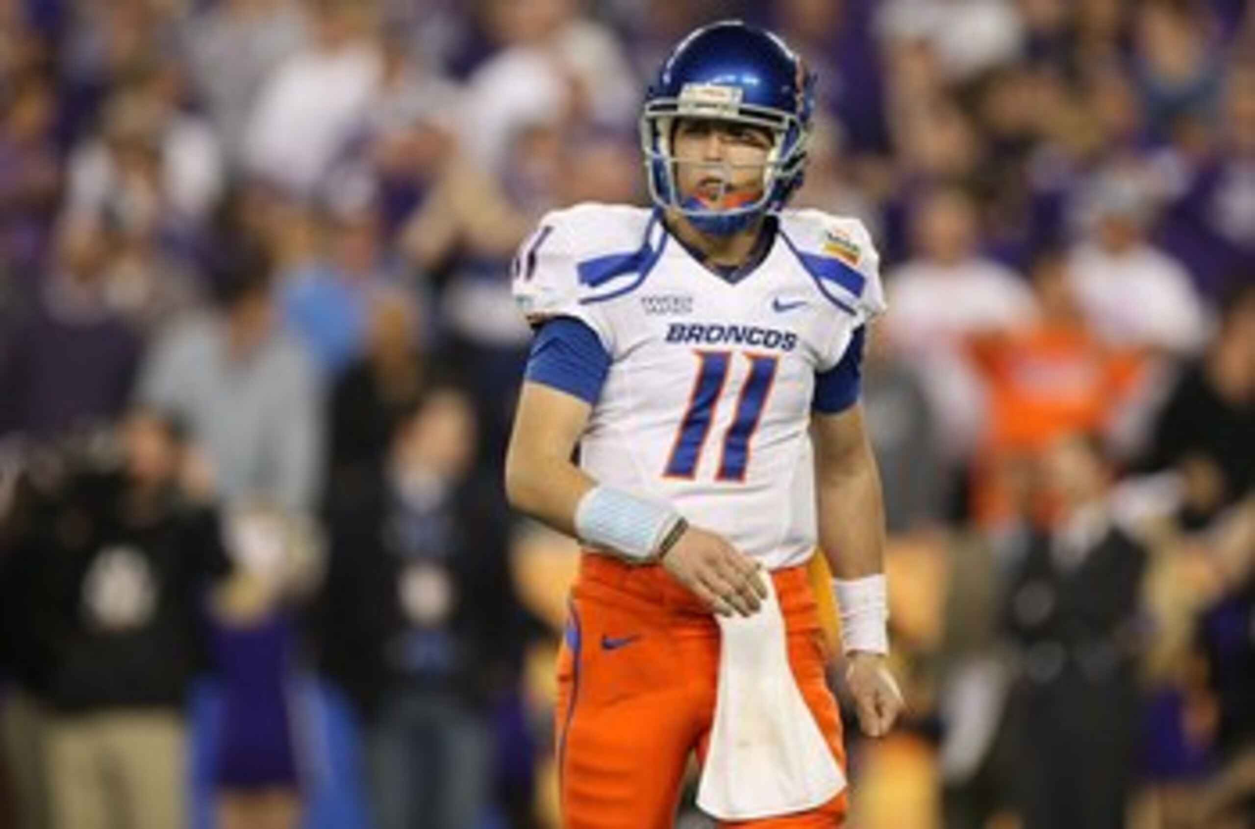 GLENDALE, AZ - JANUARY 04:  Quarterback Kellen Moore #11 of the Boise State Broncos looks over to his sideline in the second half against the TCU Horned Frogs during the Tostitos Fiesta Bowl at the Universtity of Phoenix Stadium on January 4, 2010 in Glen