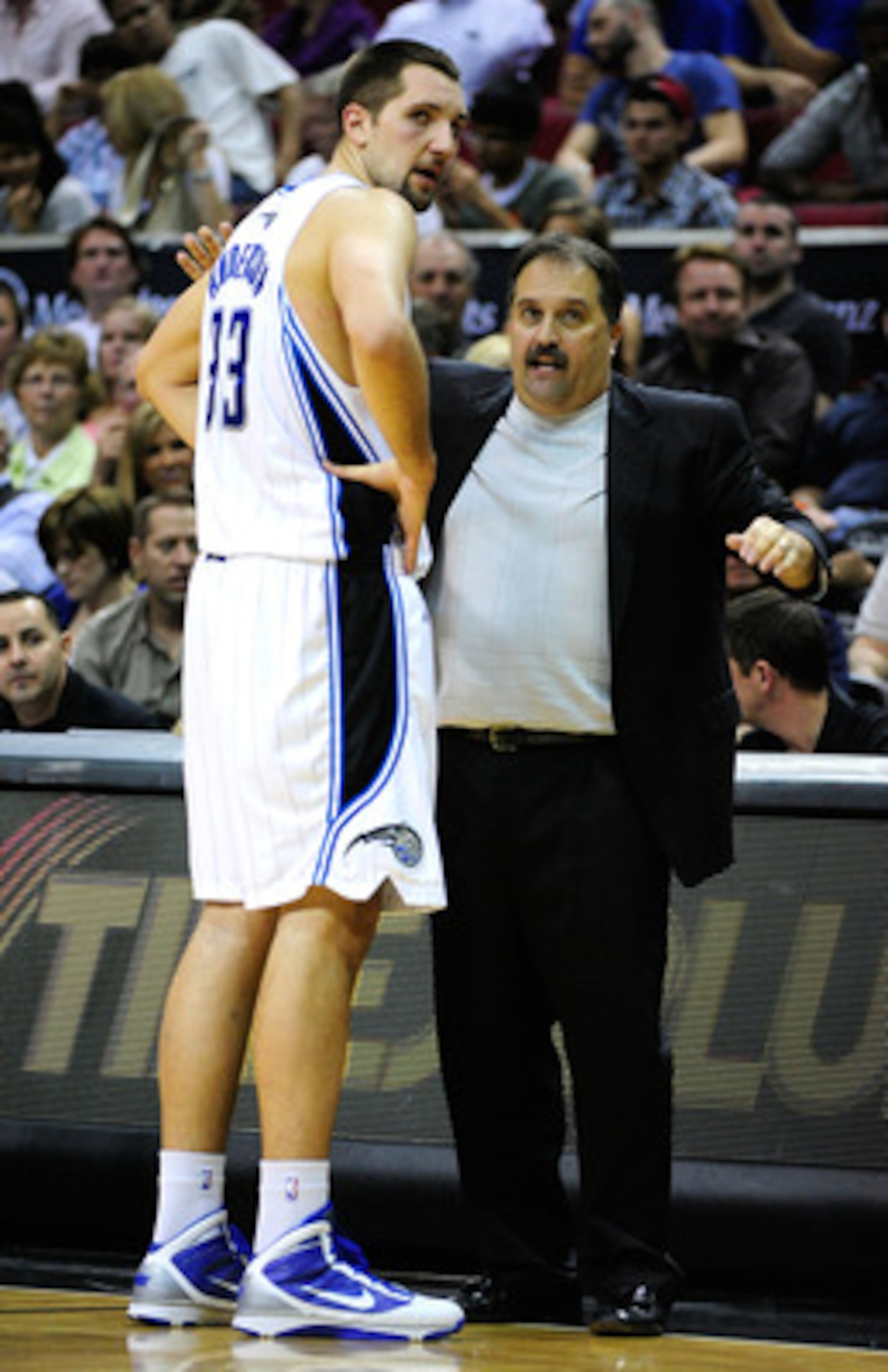 ORLANDO, FL - JANUARY 22:  Head coach Stan Van Gundy of the Orlando Magic speaks with Ryan Anderson #33  during the game against the Sacramento Kings at Amway Arena on January 22, 2010 in Orlando, Florida. NOTE TO USER: User expressly acknowledges and agr
