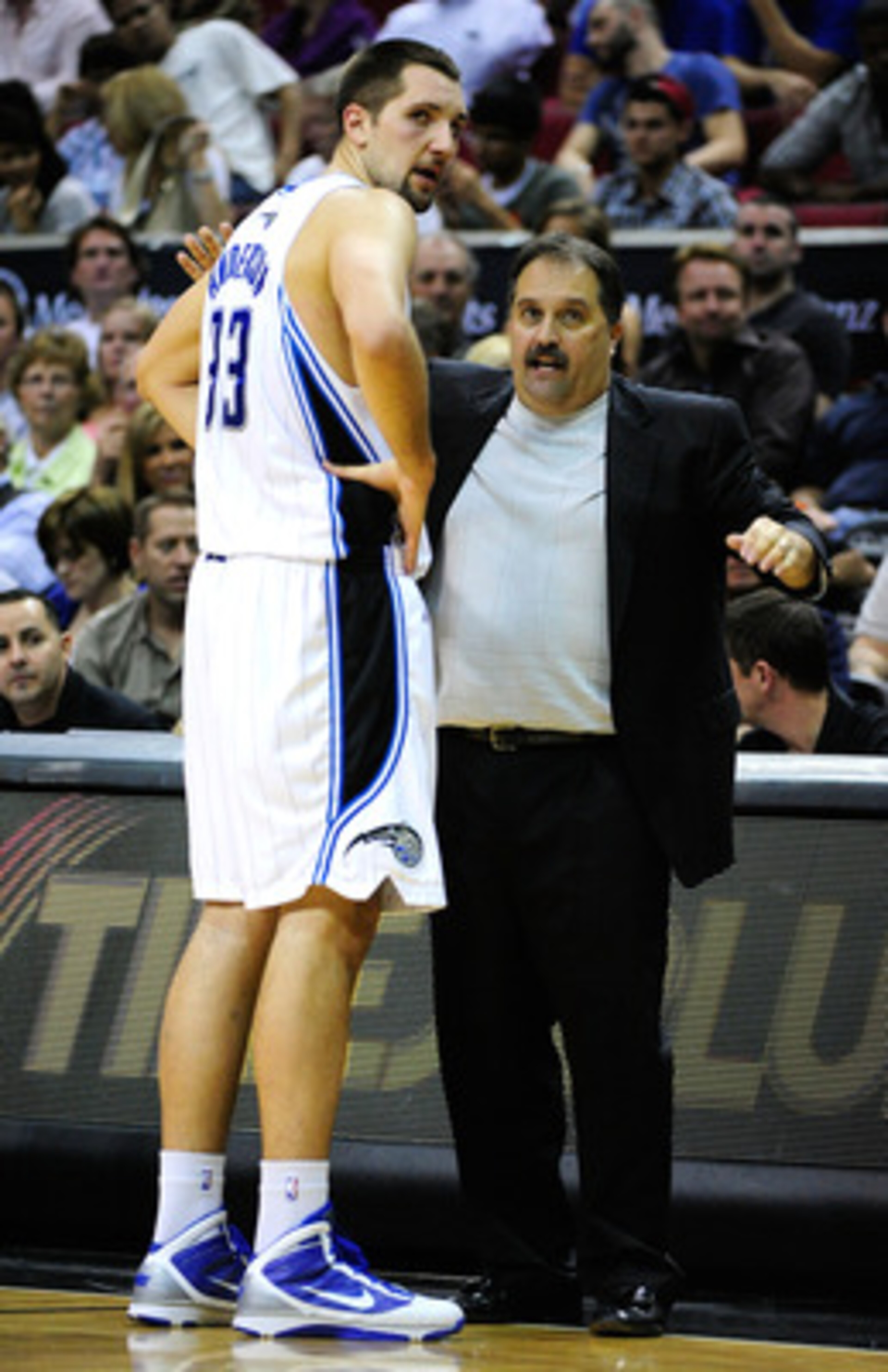 ORLANDO, FL - JANUARY 22:  Head coach Stan Van Gundy of the Orlando Magic speaks with Ryan Anderson #33  during the game against the Sacramento Kings at Amway Arena on January 22, 2010 in Orlando, Florida. NOTE TO USER: User expressly acknowledges and agr