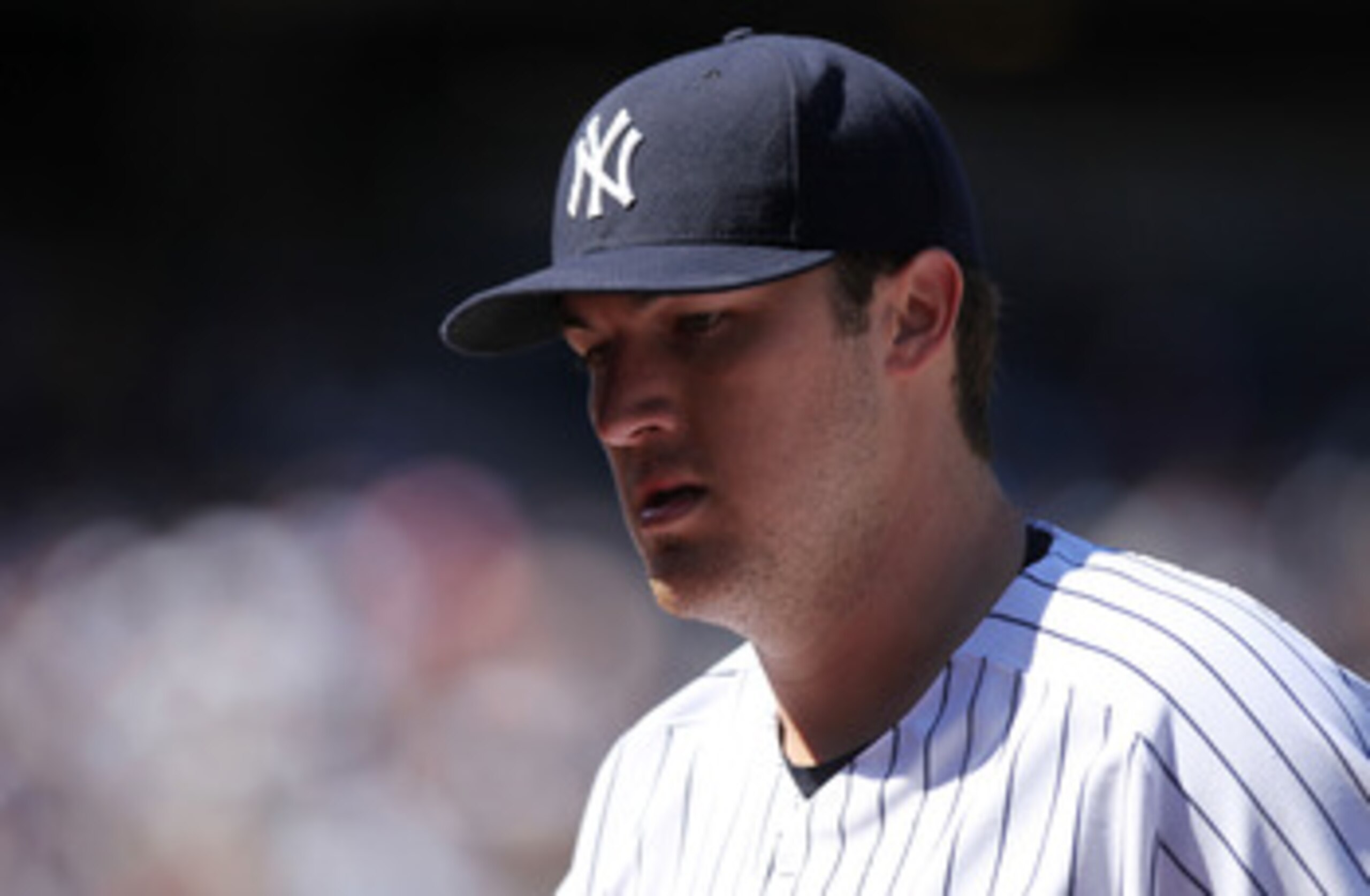 NEW YORK, NY - APRIL 03:  Phil Hughes #65 of the New York Yankees walks to the dugout against the Detroit Tigers at Yankee Stadium on April 3, 2011 in the Bronx borough of New York City.  (Photo by Nick Laham/Getty Images)