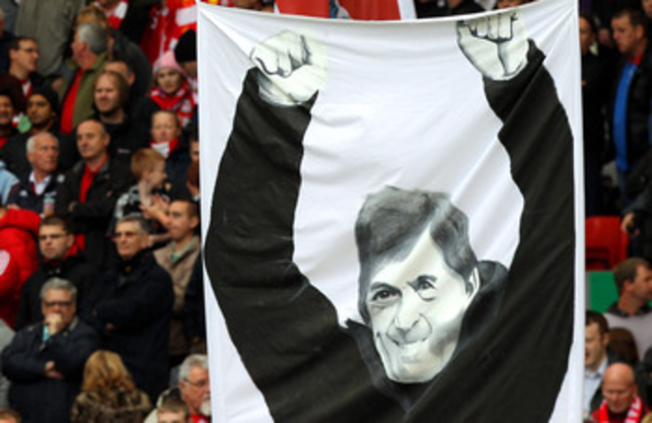 LIVERPOOL, ENGLAND - MAY 15:  Liverpool fans display banners dedicated to former player and now manager, Kenny Dalglish during the Barclays Premier League match between Liverpool and Tottenham Hotspur at Anfield on May 15, 2011 in Liverpool, England.  (Ph