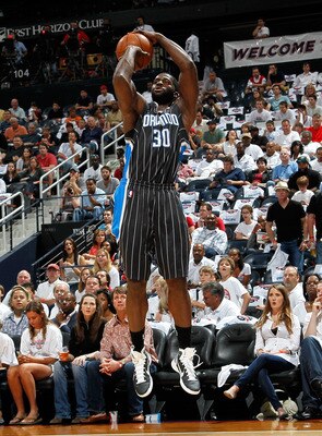 ATLANTA, GA - APRIL 24:  Brandon Bass #30 of the Orlando Magic against the Atlanta Hawks during Game Four of the Eastern Conference Quarterfinals in the 2011 NBA Playoffs at Philips Arena on April 24, 2011 in Atlanta, Georgia.  NOTE TO USER: User expressl