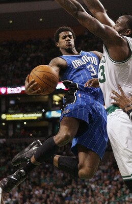 BOSTON, MA - FEBRUARY 06:  Earl Clark #3 of the Orlando Magic tries to get around Kendrick Perkins #43 of the Boston Celtics on February 6, 2011 at the TD Garden in Boston, Massachusetts. The Celtics defeated the Magic 91-80. NOTE TO USER: User expressly