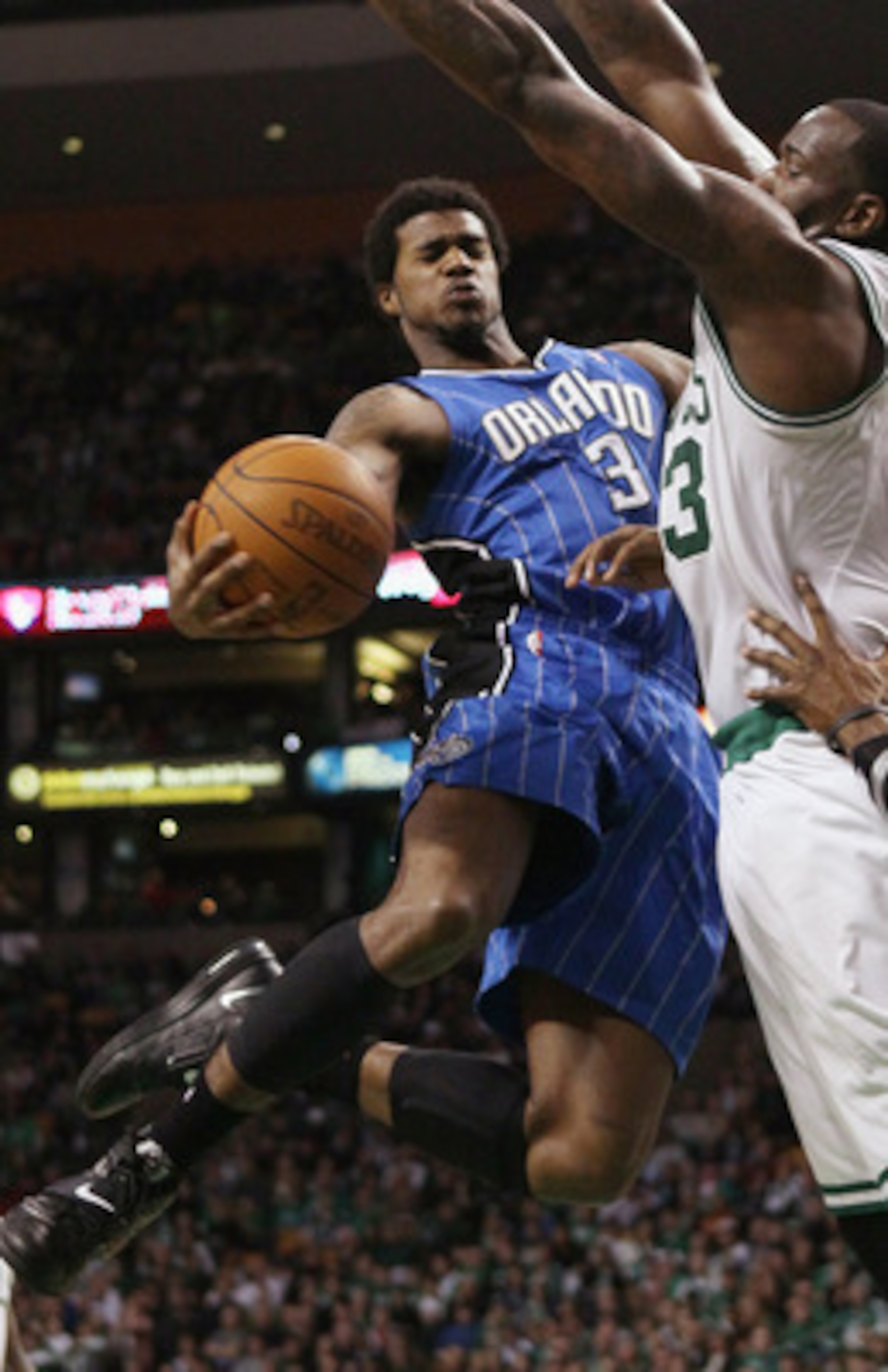 BOSTON, MA - FEBRUARY 06:  Earl Clark #3 of the Orlando Magic tries to get around Kendrick Perkins #43 of the Boston Celtics on February 6, 2011 at the TD Garden in Boston, Massachusetts. The Celtics defeated the Magic 91-80. NOTE TO USER: User expressly