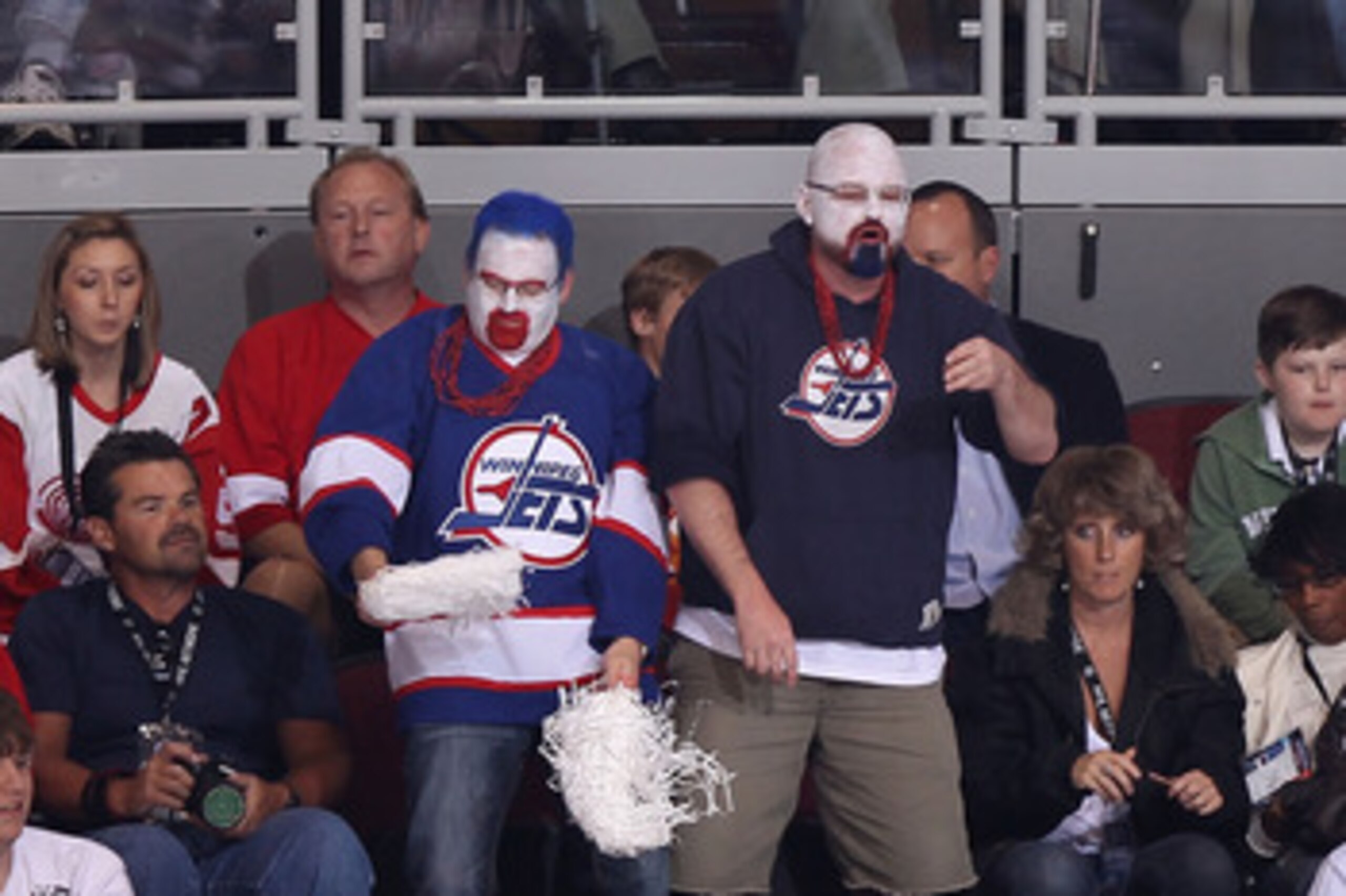 GLENDALE, AZ - APRIL 20:  Fans dressed in Winnipeg Jets uniforms attend Game Four of the Western Conference Quarterfinals between the Detroit Red Wings and the Phoenix Coyotes during the 2011 NHL Stanley Cup Playoffs at Jobing.com Arena on April 20, 2011 