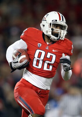 TUCSON, AZ - OCTOBER 23:  Wide receiver Juron Criner #82 of the Arizona Wildcats runs with the ball during the college football game against the Washington Huskies at Arizona Stadium on October 23, 2010 in Tucson, Arizona.   The Wildcats defeated the Husk