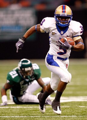NEW ORLEANS - SEPTEMBER 04:  Damaris Johnson #3 of the Tulsa Golden Hurricanes runs past Charles Harris #21 of the Tulane Green Wave at the Louisiana Superdome on September 4, 2009 in New Orleans, Louisiana.  (Photo by Chris Graythen/Getty Images)