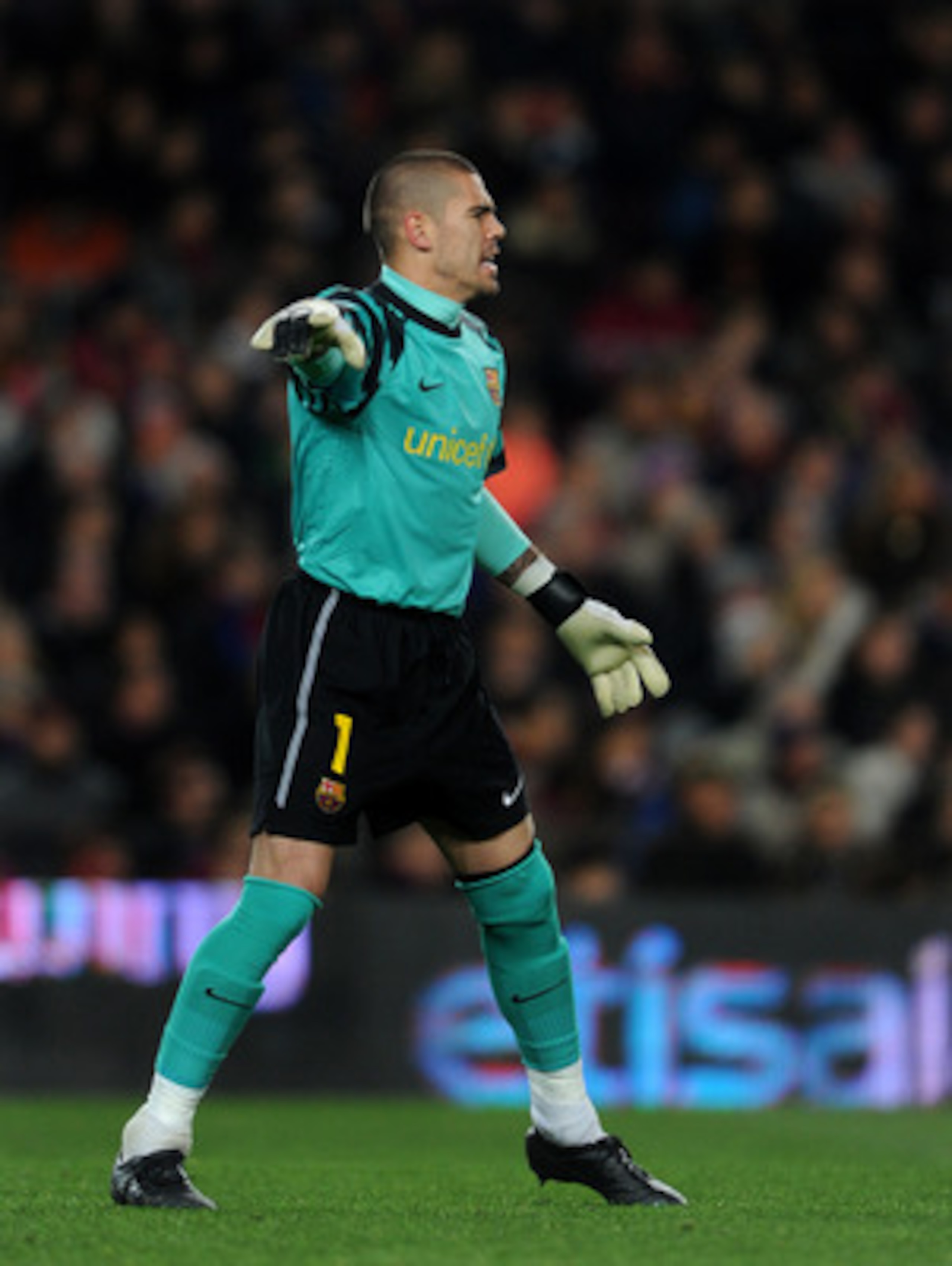 BARCELONA, SPAIN - JANUARY 22:  Goalkeeper Victor Valdes of Barcelona reacts during the la liga match between Barcelona and Racing Santander at the Camp Nou stadium on January 22, 2011 in Barcelona, Spain.  (Photo by Jasper Juinen/Getty Images)