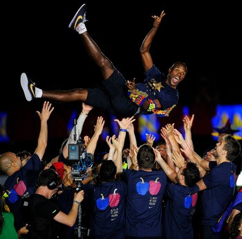 BARCELONA, SPAIN - MAY 13:  Eric Abidal of FC Barcelona is lifted by his team-mates during the celebrations for winning the Spanish Liga at the Camp Nou Stadium on May 13, 2011 in Barcelona, Spain.  (Photo by David Ramos/Getty Images)